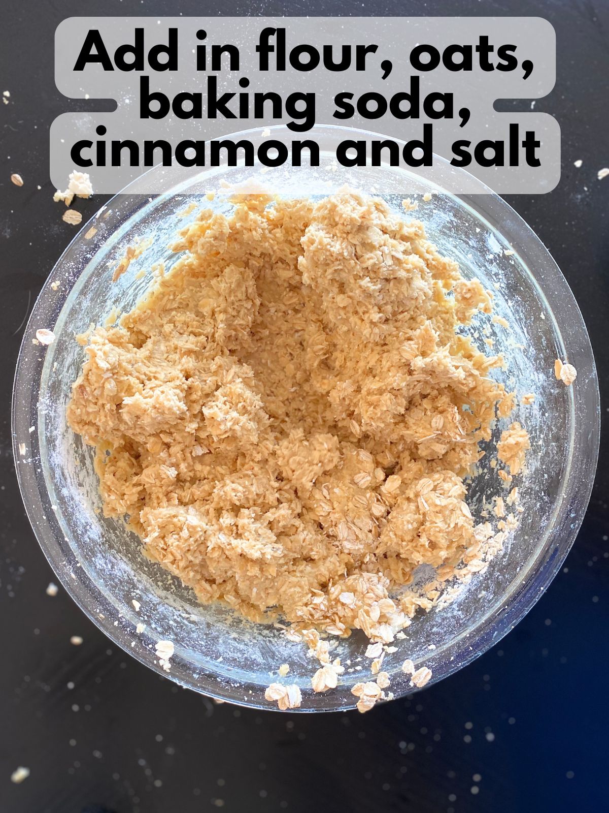 dry ingredients mixed into white chocolate cranberry oatmeal cookie dough