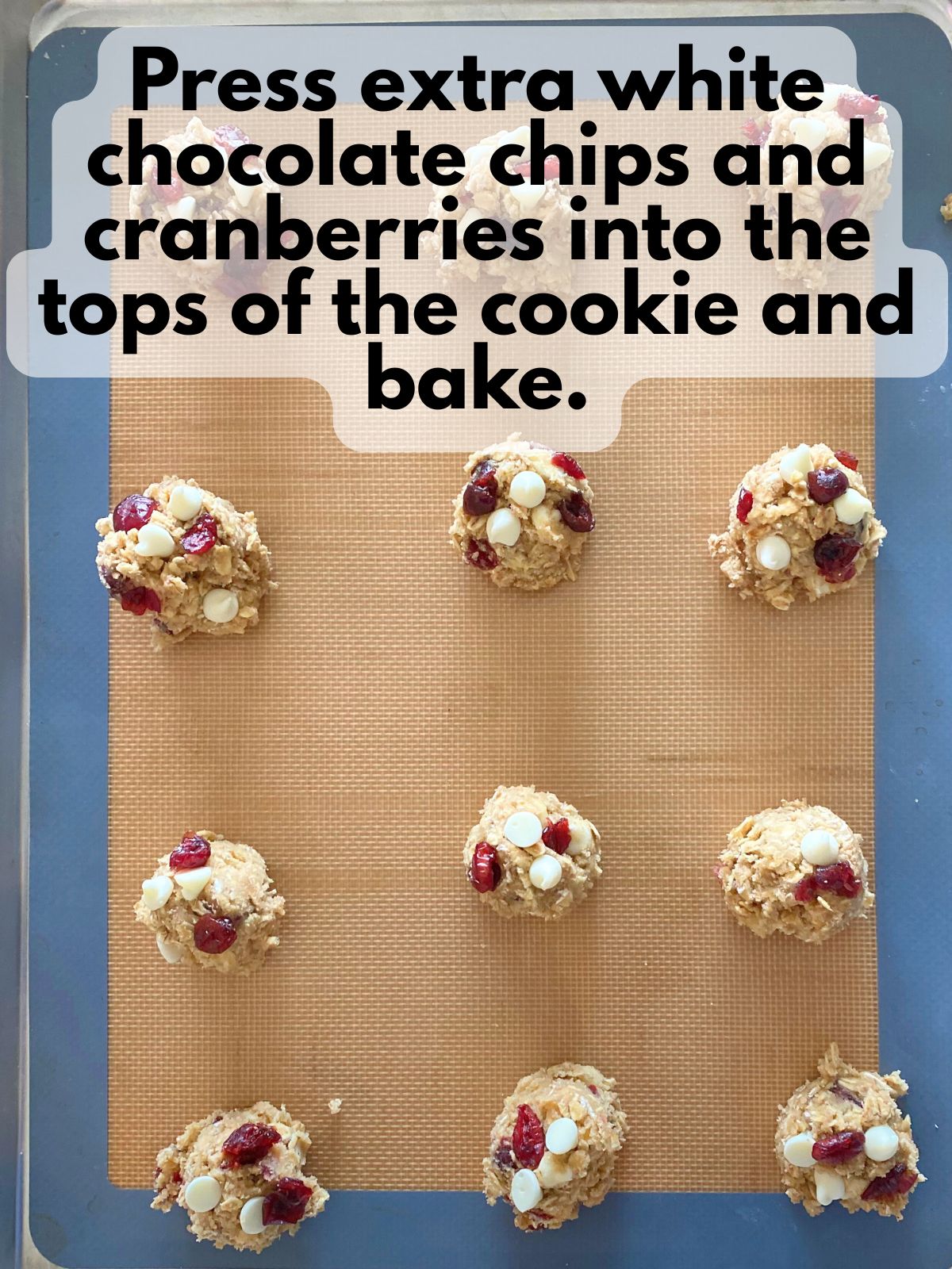 extra cranberries and white chocolate chips pressed into the tops of cookies