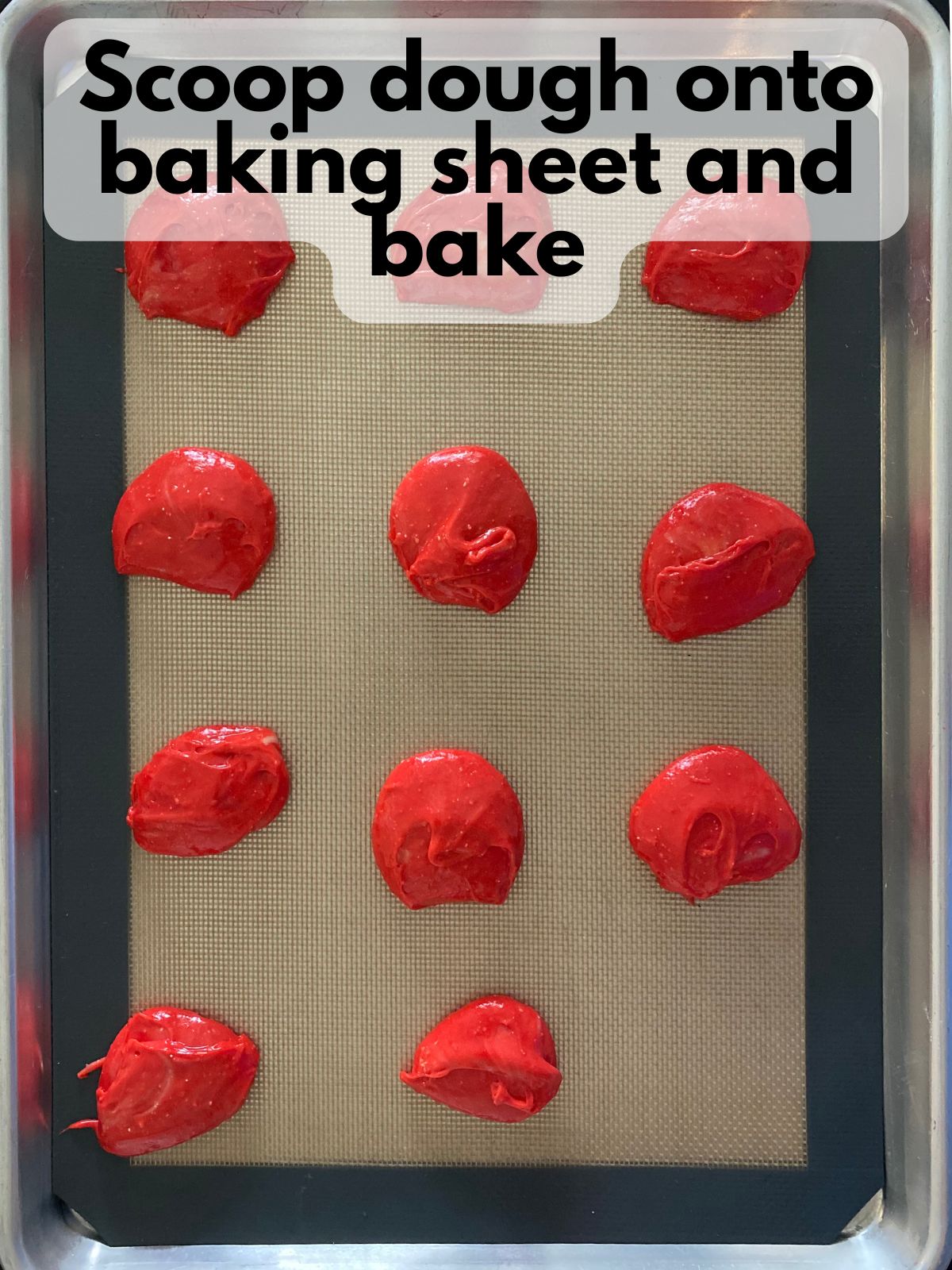 red whoopie pie batter on a baking sheet