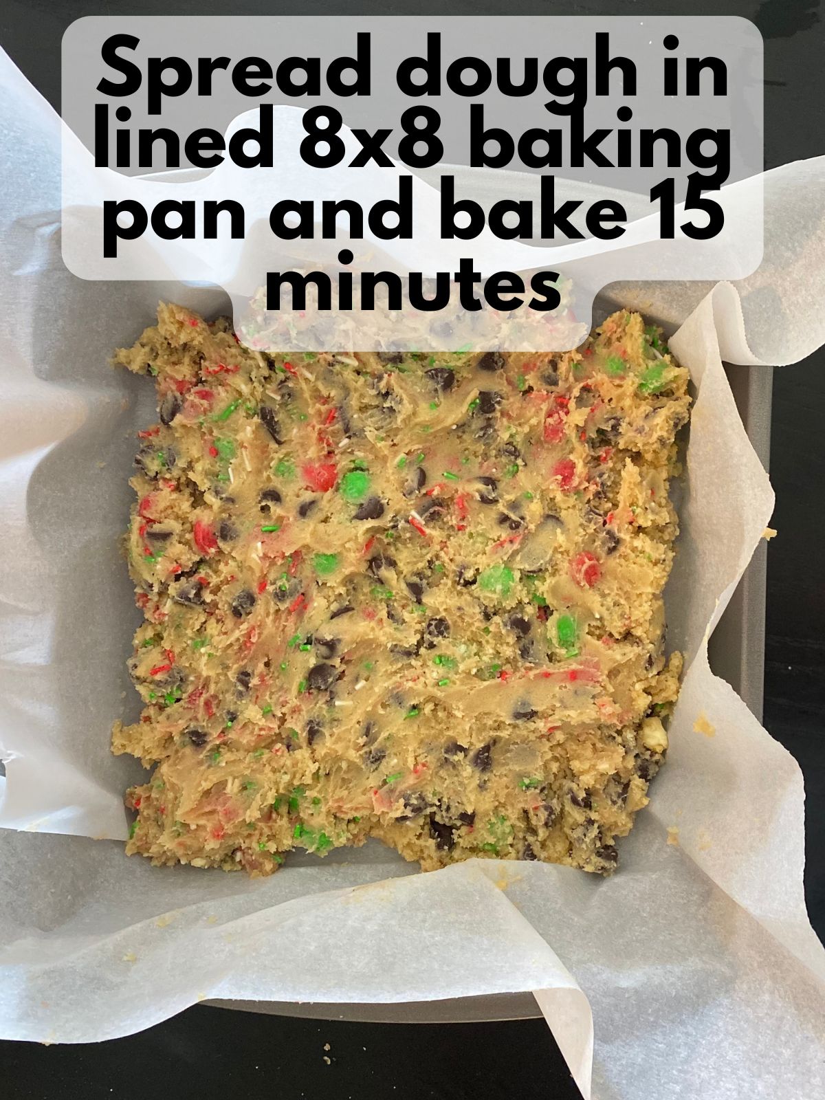 Christmas chocolate chip cookie bar dough spread in pan