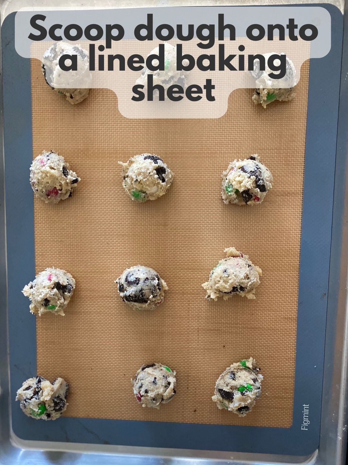 Christmas oreo cookie dough scooped onto a baking sheet