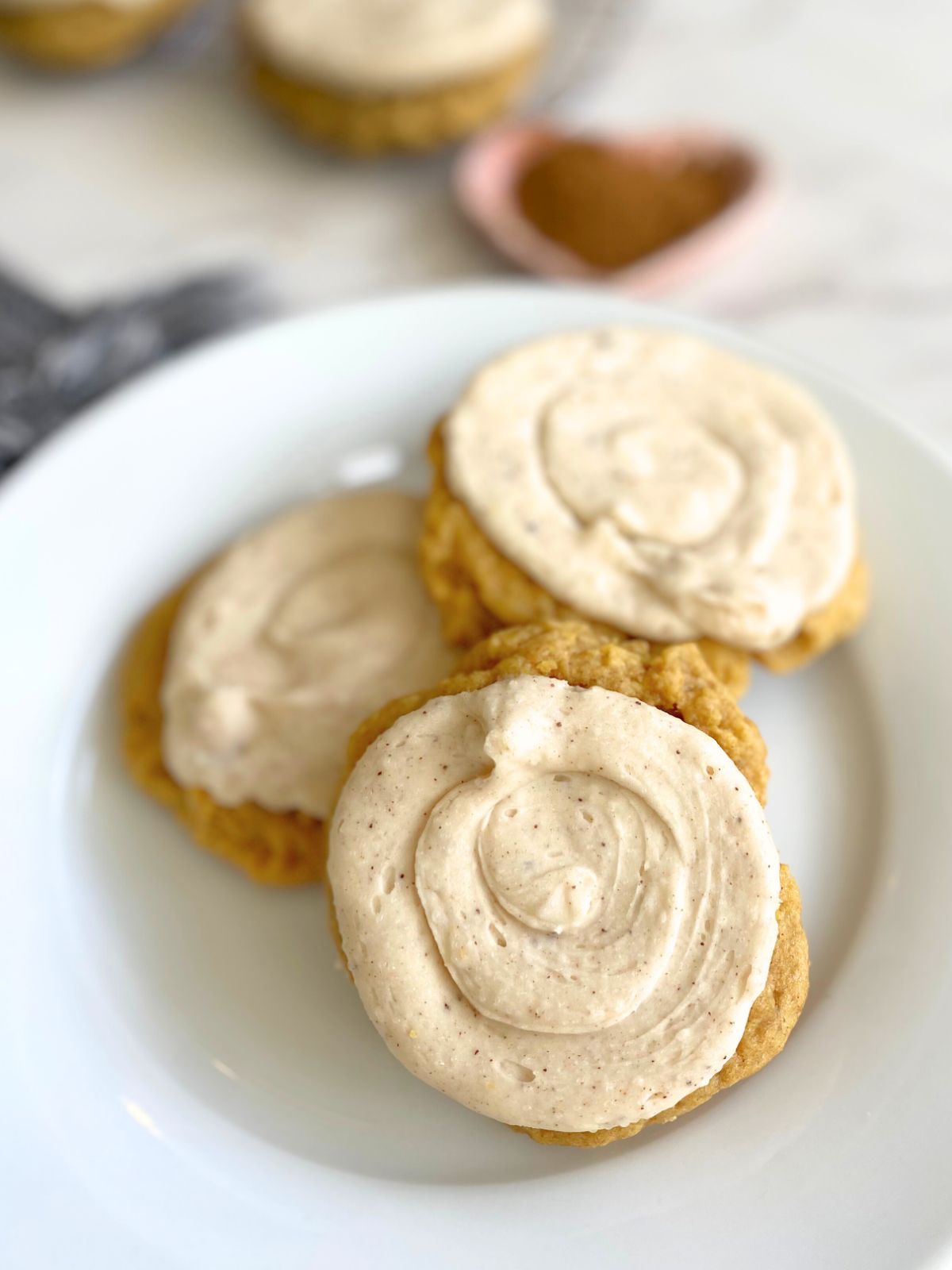 pumpkin sugar cookies with brown butter maple frosting