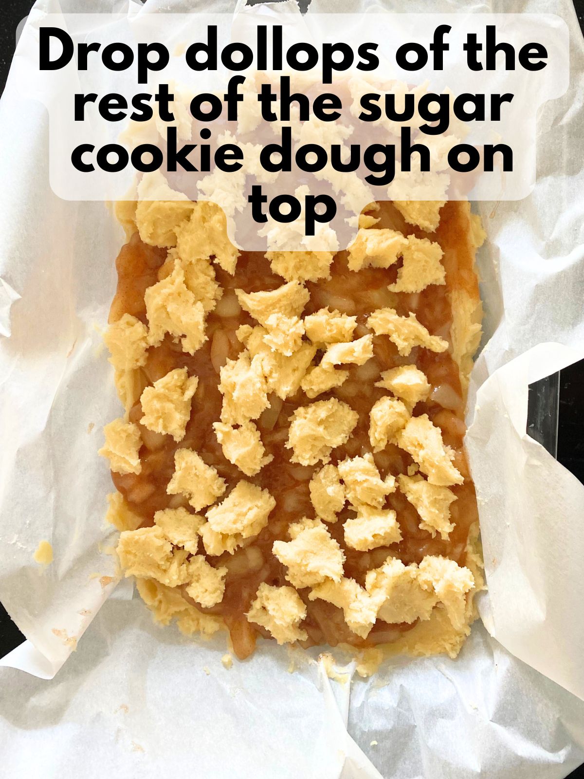extra sugar cookie dough dropped on top of applie pie filling