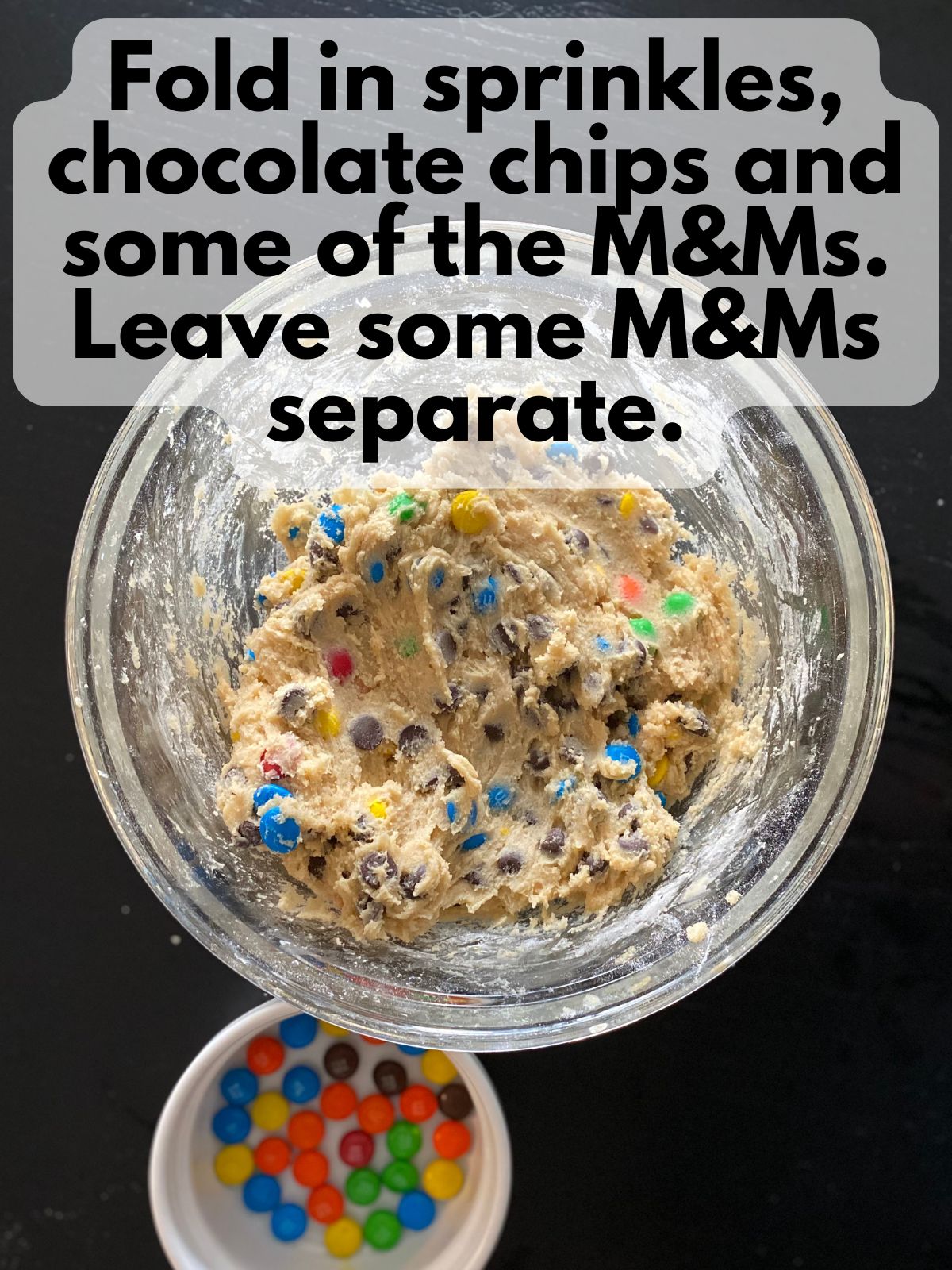 chocolate chips and M&Ms folded into dough