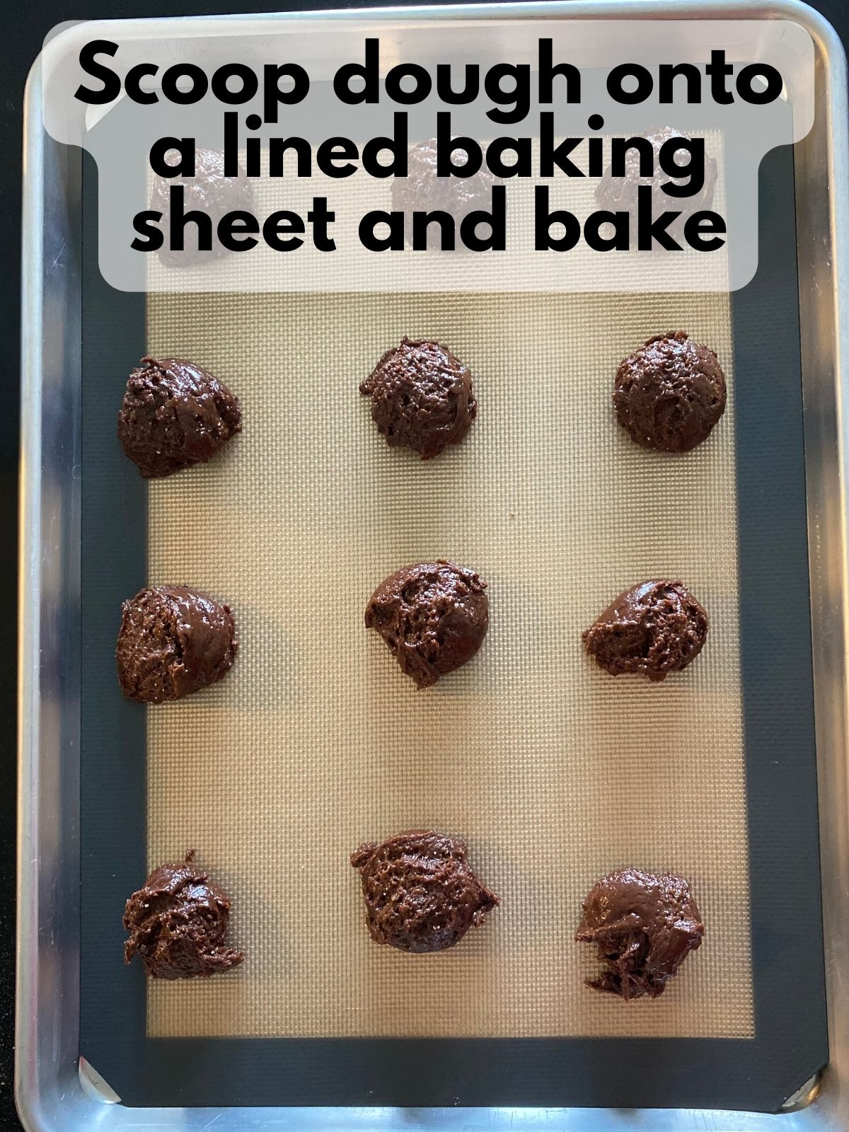 chocolate cake mix cookie dough scooped on a baking sheet