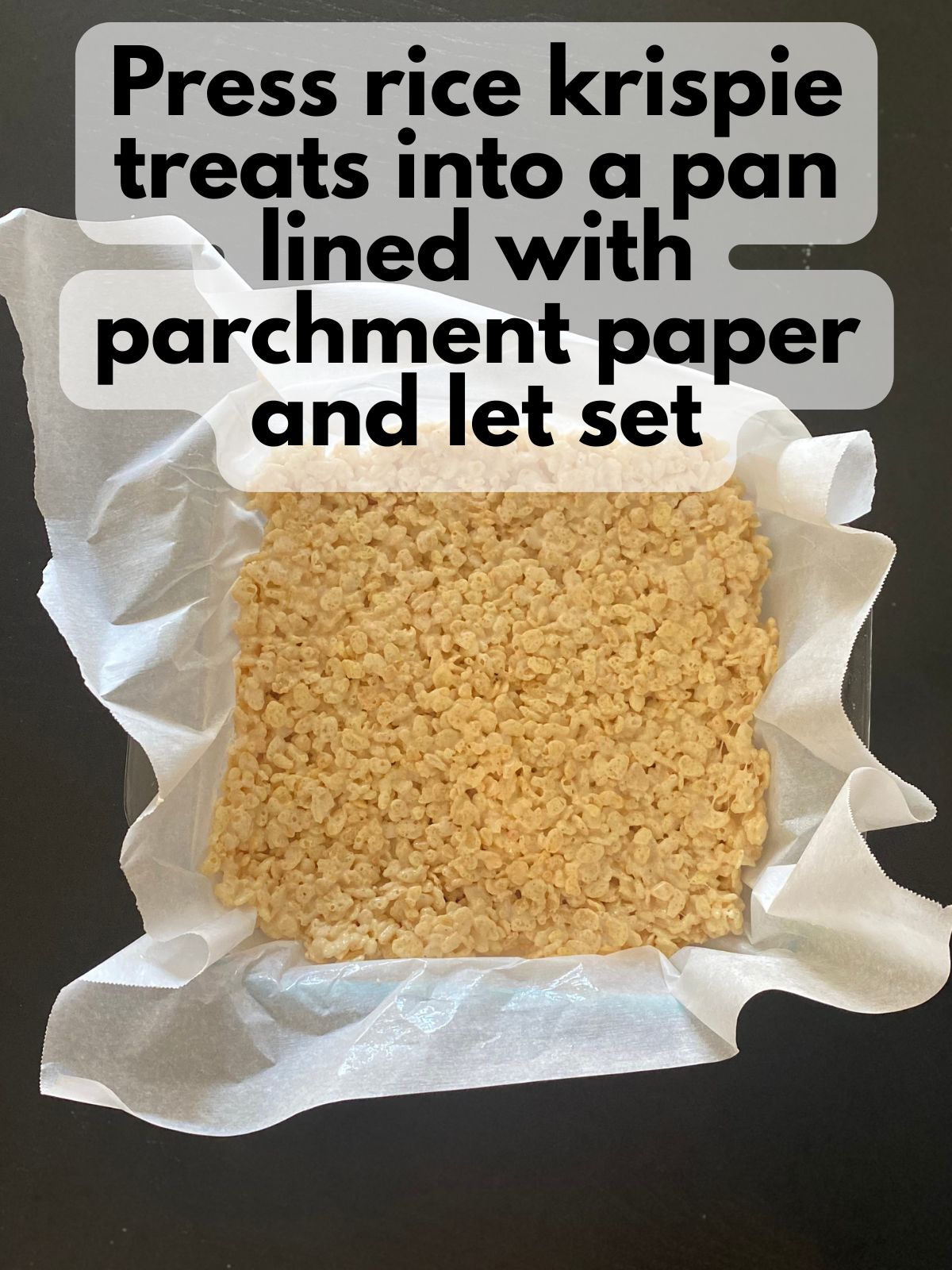 rice krispie treats pressed into a square pan
