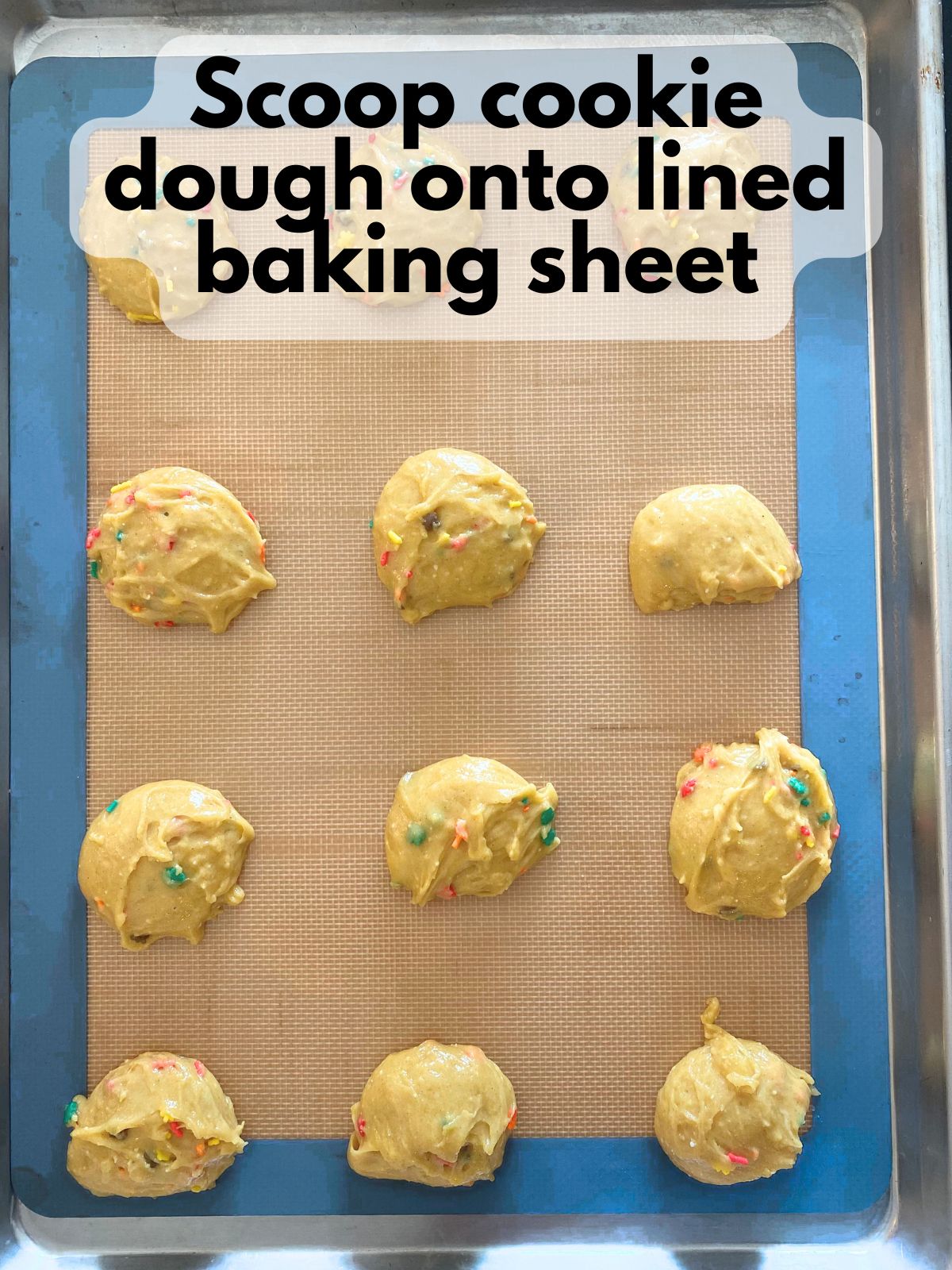 cookie dough scooped onto a baking sheet