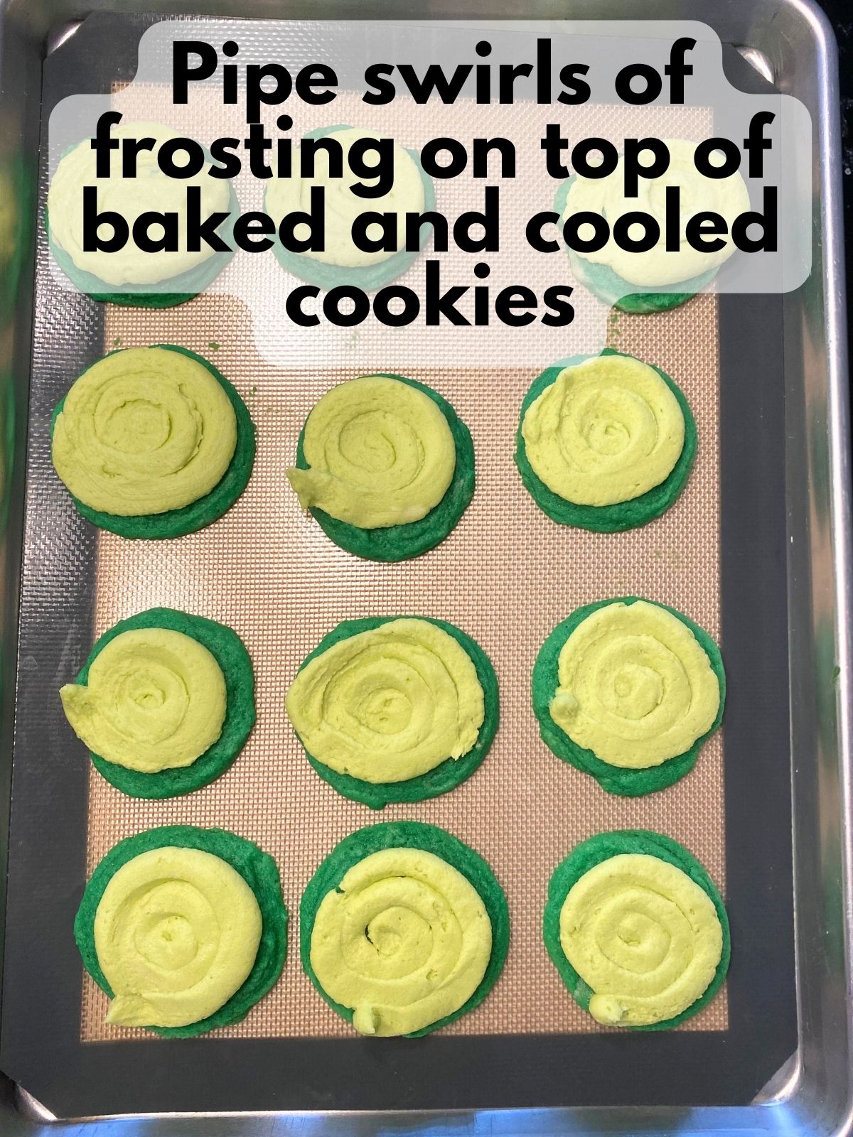 light green frosting piped on green sugar cookies
