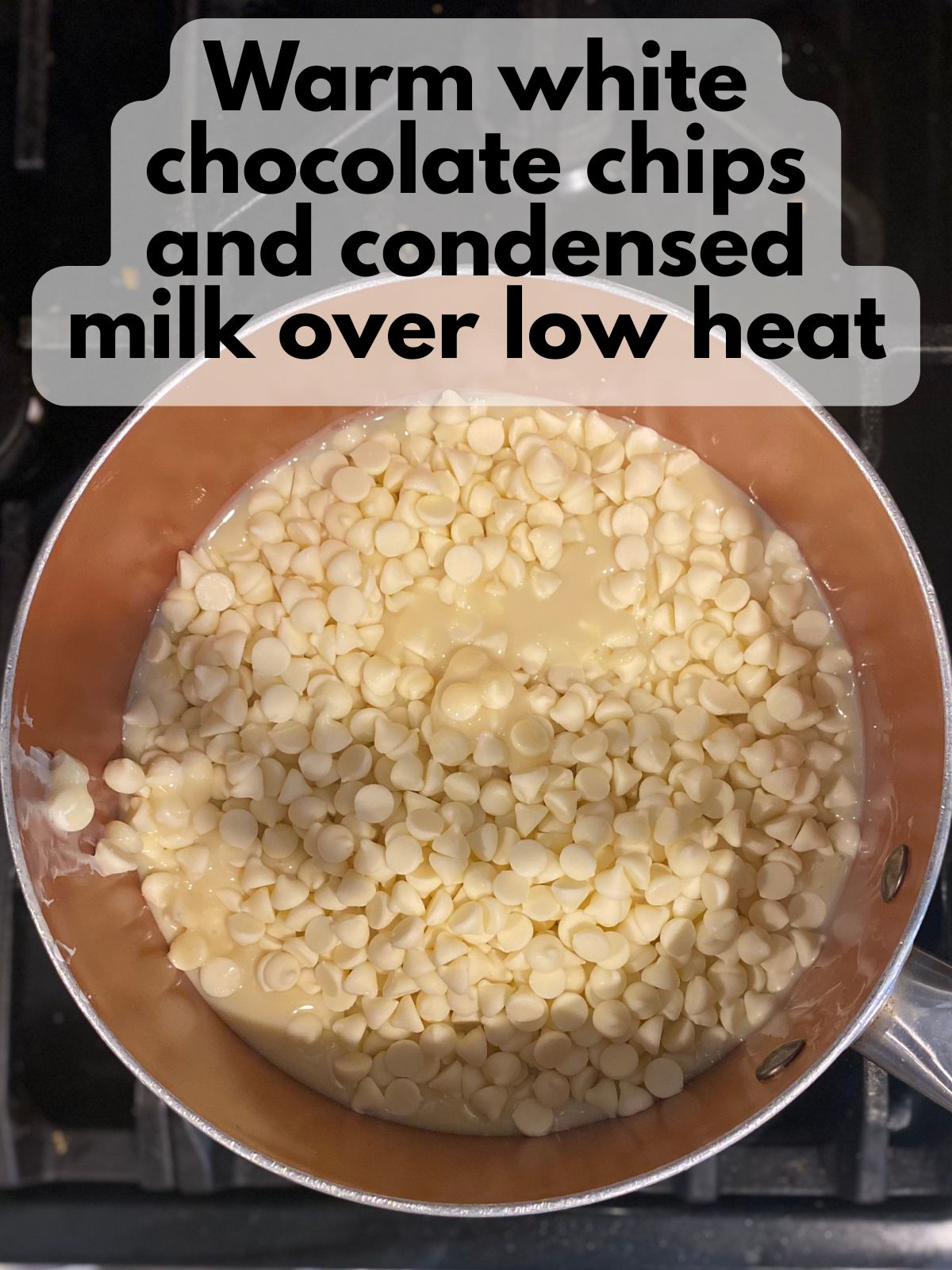 white chocolate chips and condensed milk in a pan