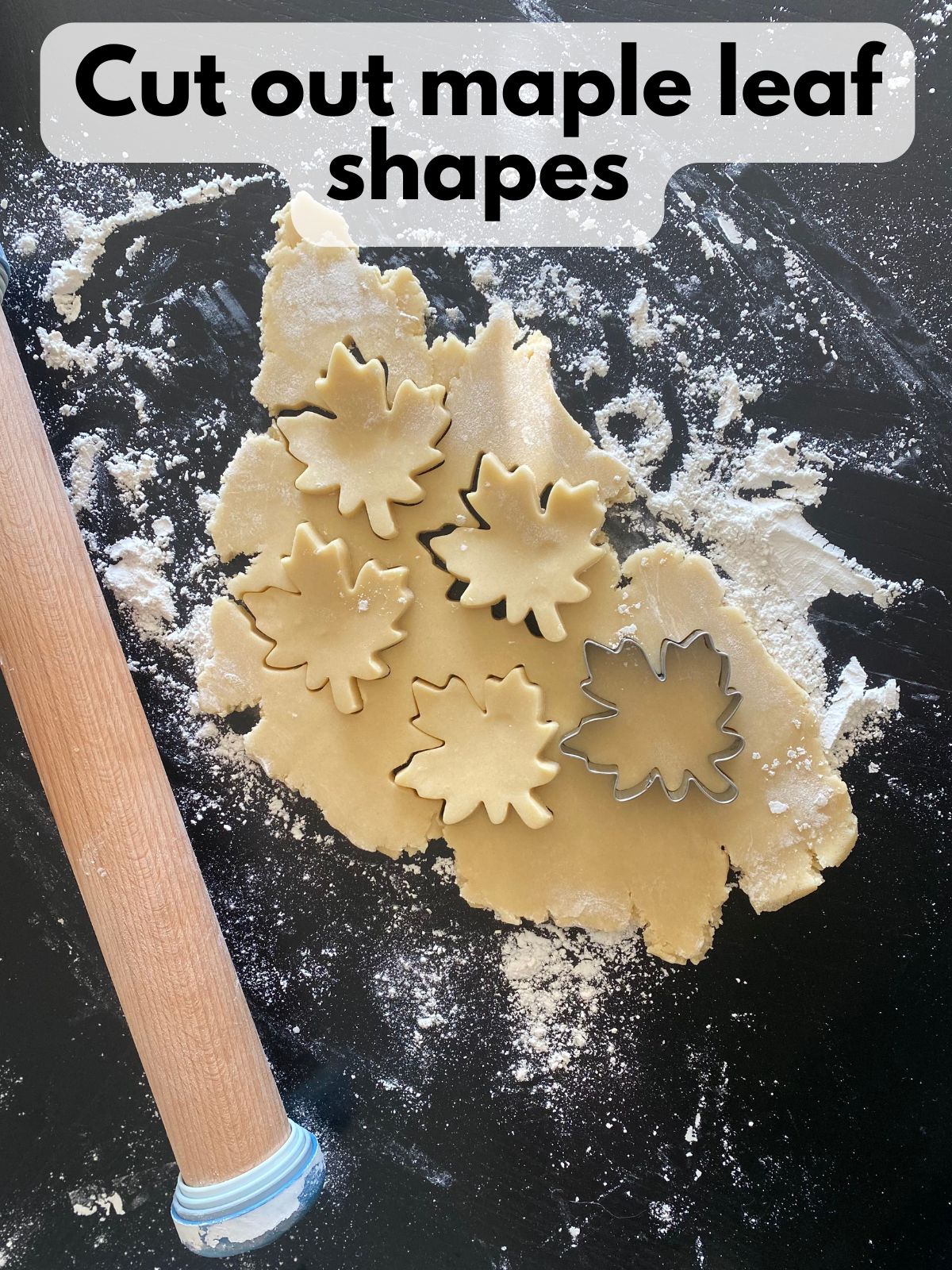 cutout cookie dough cut out in the shape of a maple leaf