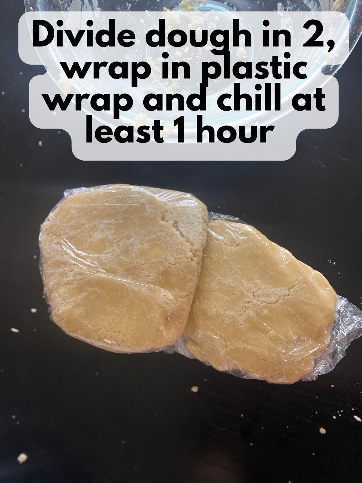 cutout cookie dough wrapped in plastic to chill
