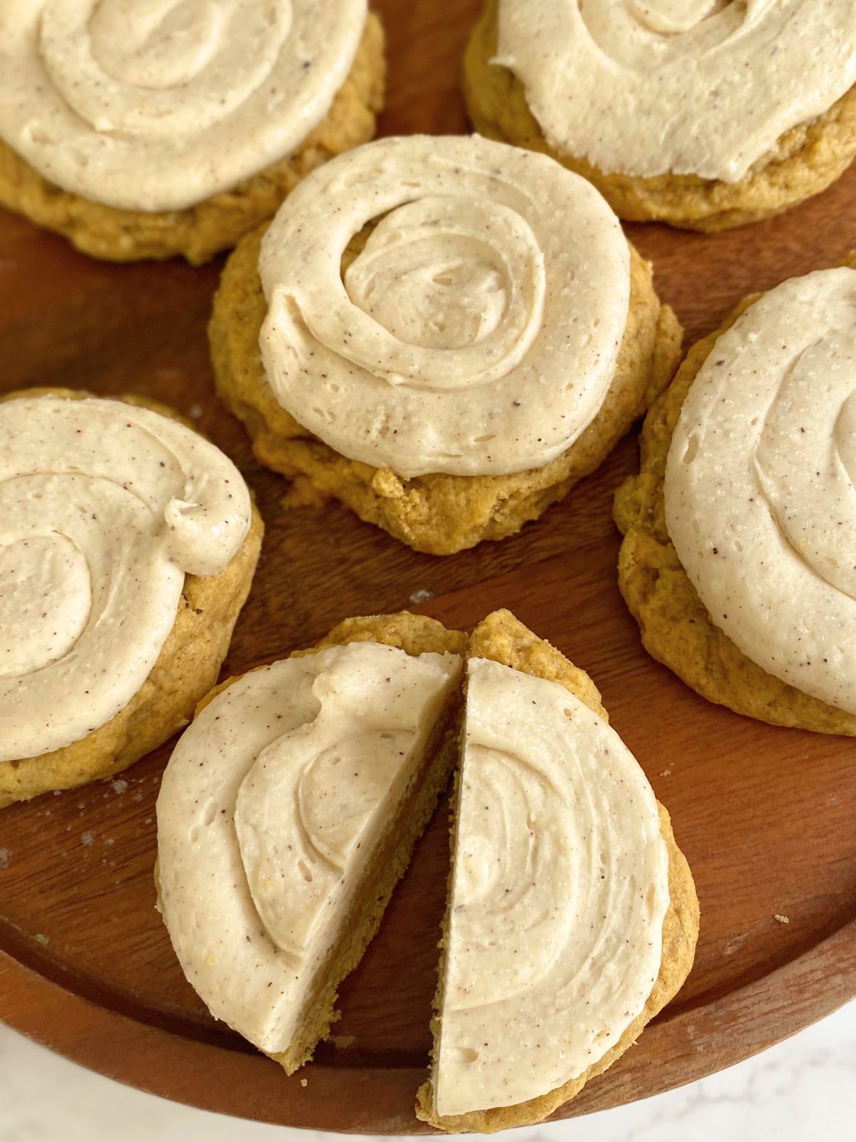 pumpkin sugar cookies with brown butter maple frosting