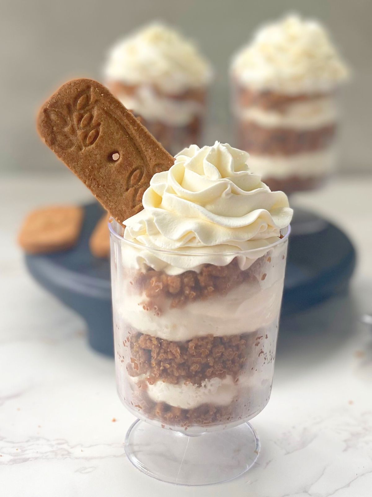 Biscoff cheesecake parfaits with layers of Biscoff cookie crumbs and cheesecake filling