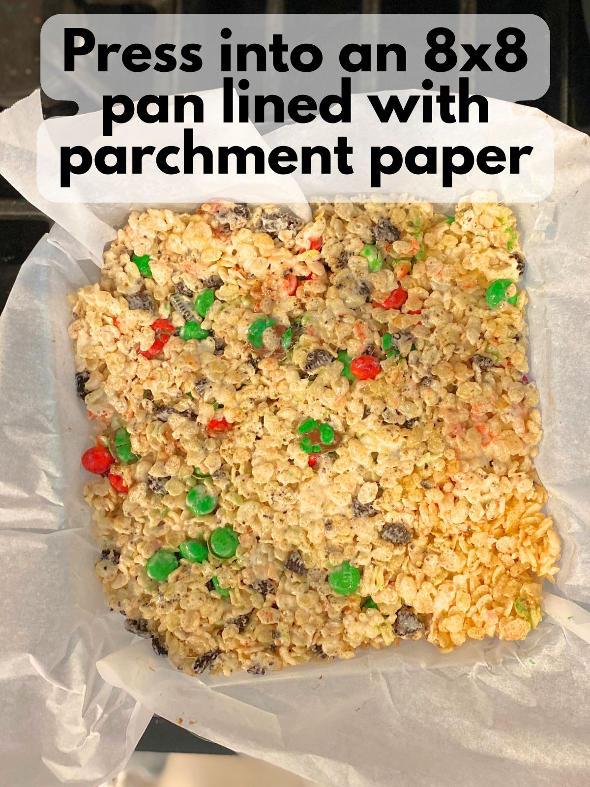 rice krispie treats pressed into an 8x8 pan