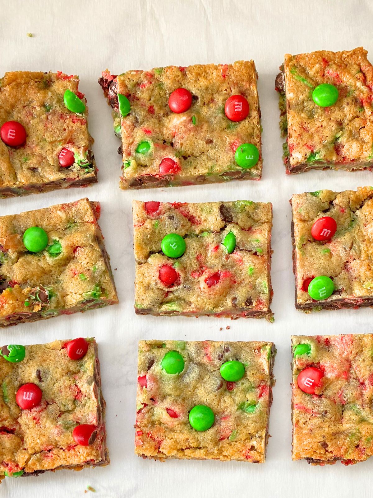 cookie bars with red and green sprinkles and red and green M&Ms