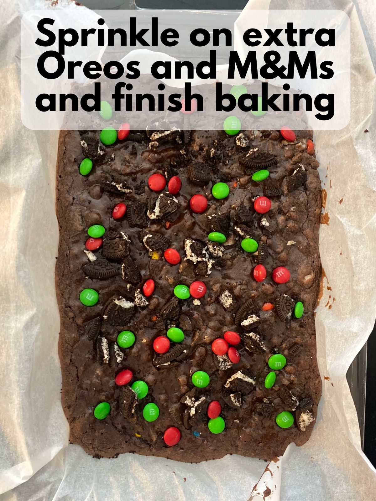 oreos and M&Ms sprinkled on parbaked brownies