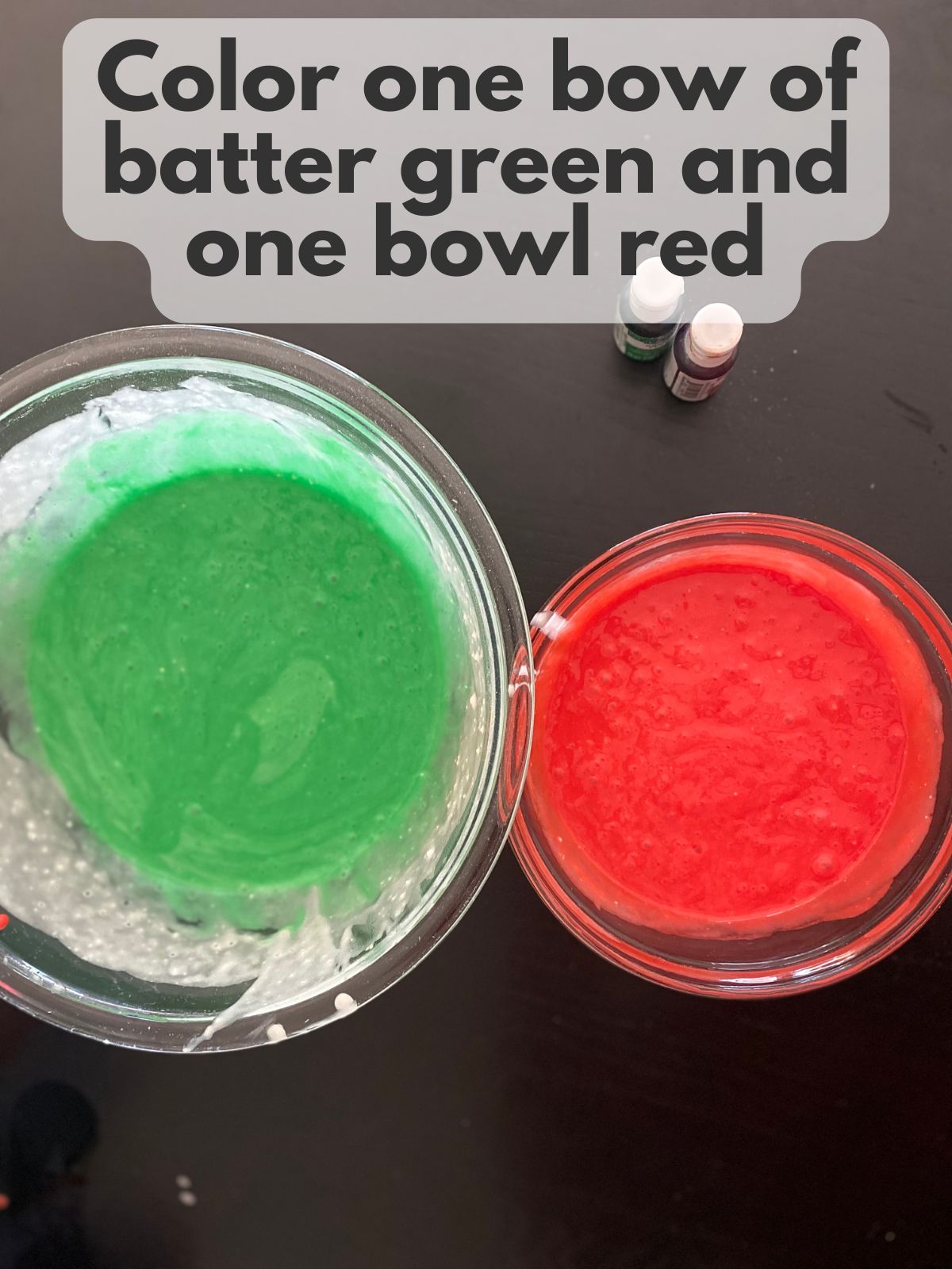 one bowl of green cake batter and one bowl of red cake batter