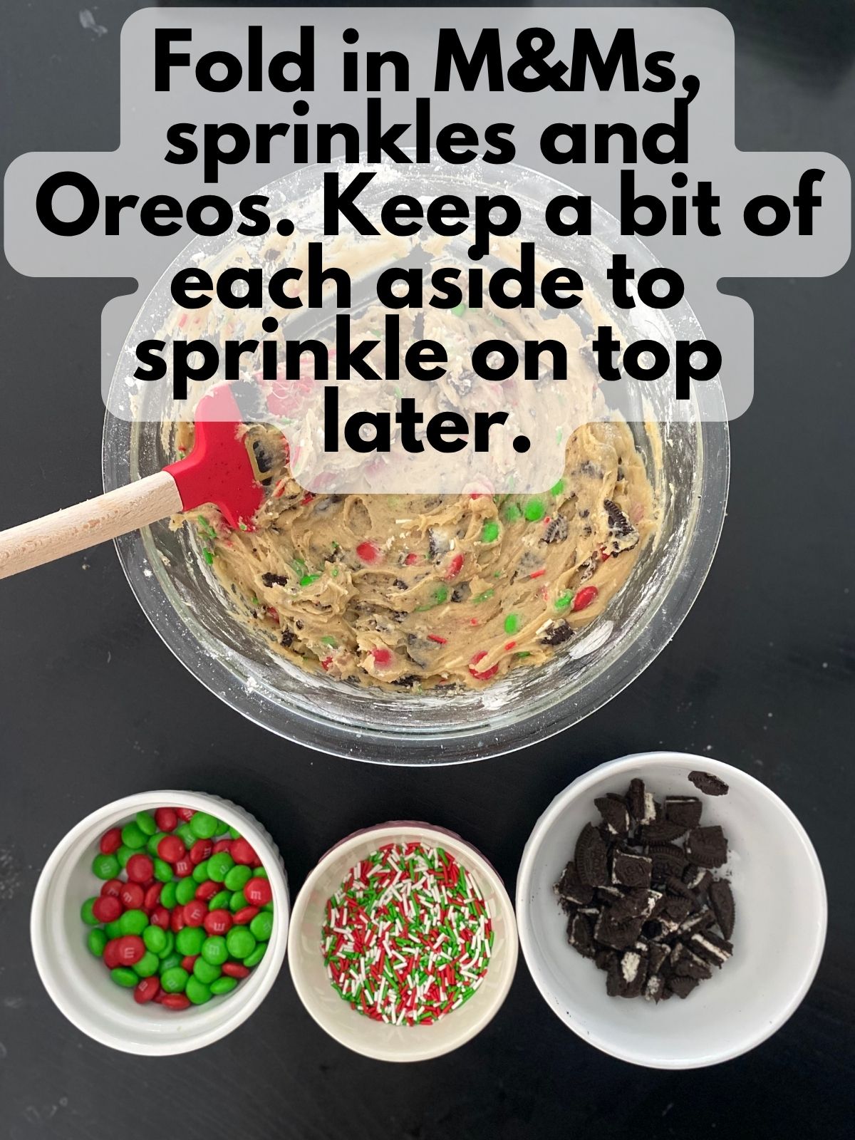 Christmas blondie batter with some M&Ms, Oreos and sprinkles folded in. Some M&Ms, Oreos and sprinkles are kept separate