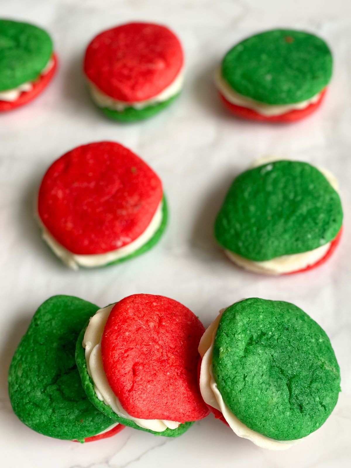 whoopie pies with red and green cookies and vanilla buttercream filling