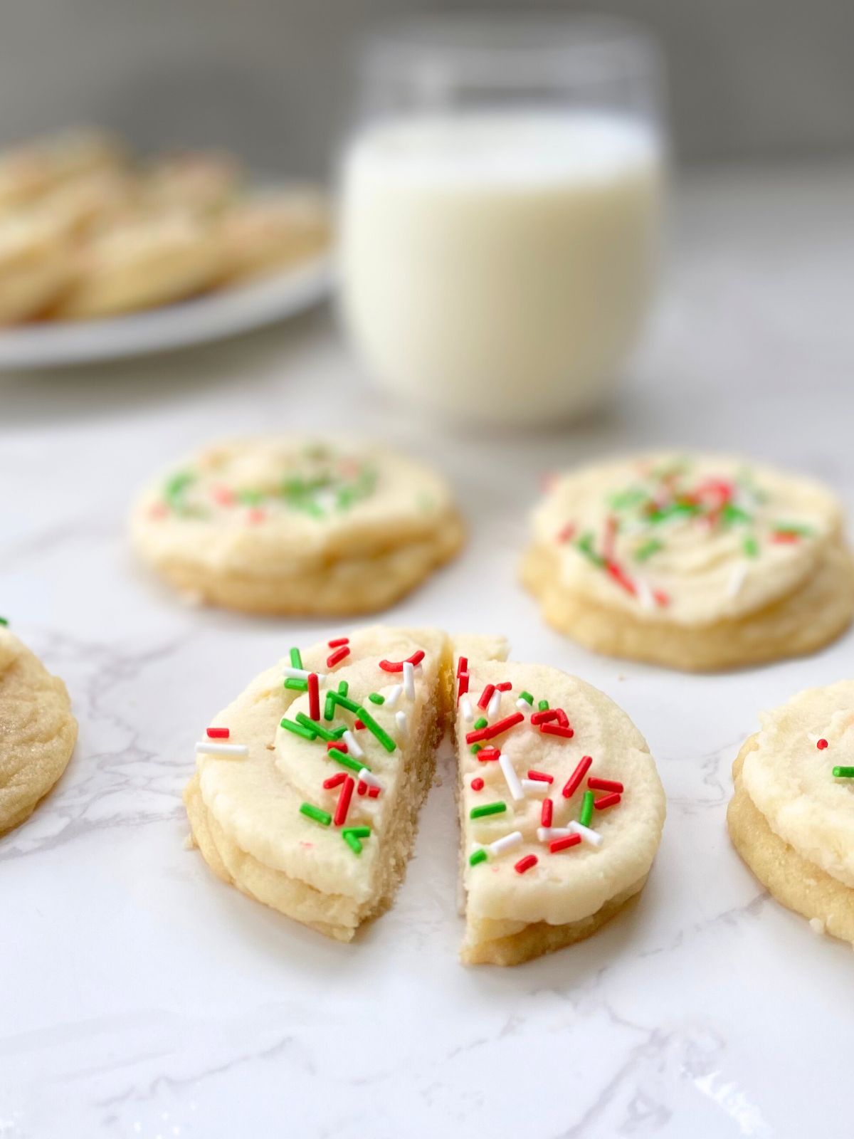 sugar cookies with vanilla buttercream and Christmas sprinkles