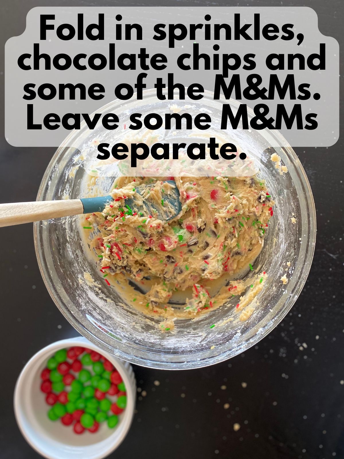 M&M cookie bar batter with M&Ms, chocolate chips and sprinkles folded in