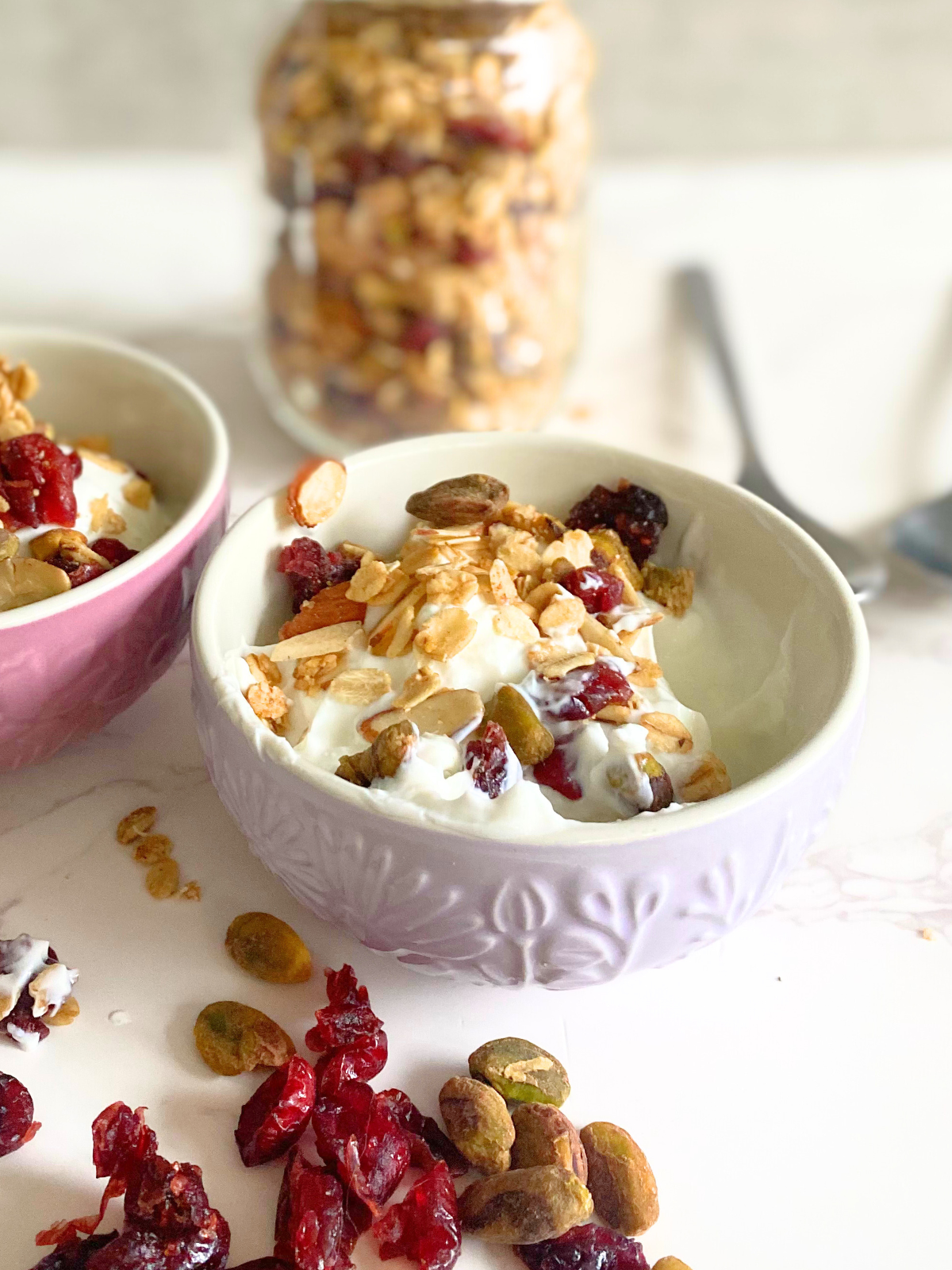 Christmas morning granola on top of yogurt in a bowl