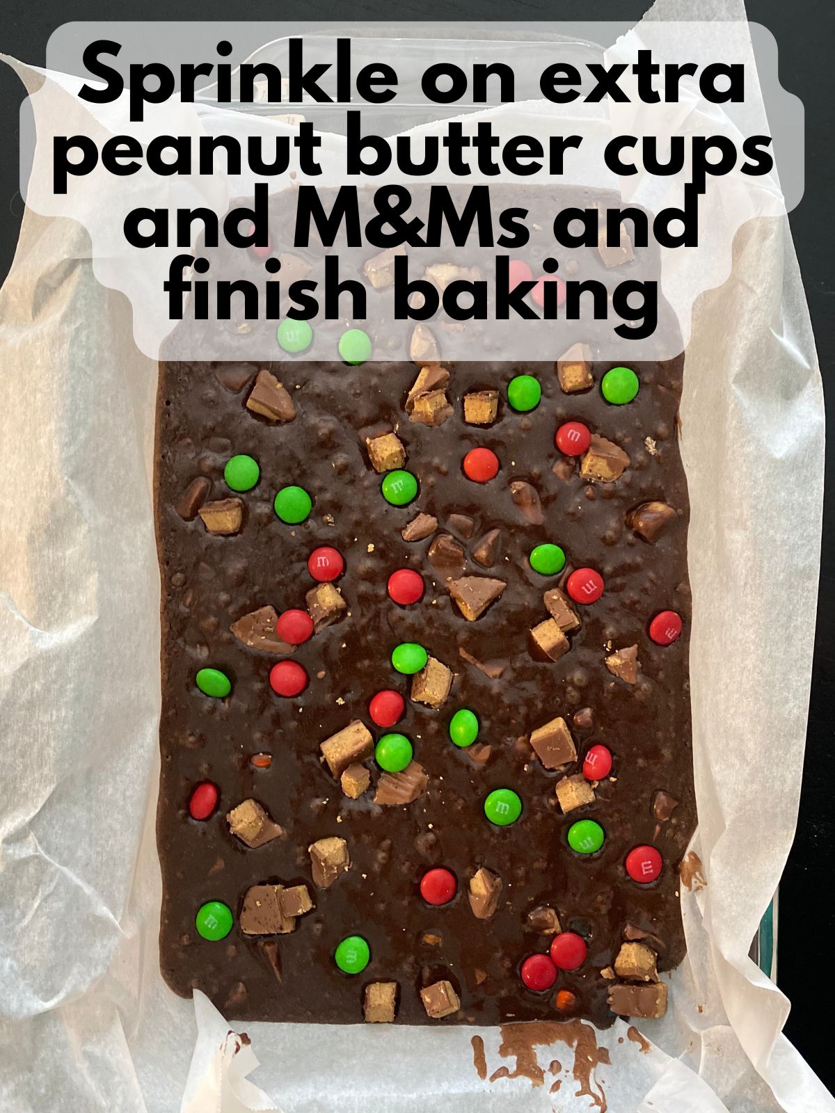 Parbaked brownies with peanut butter cups and M&Ms sprinkled on top