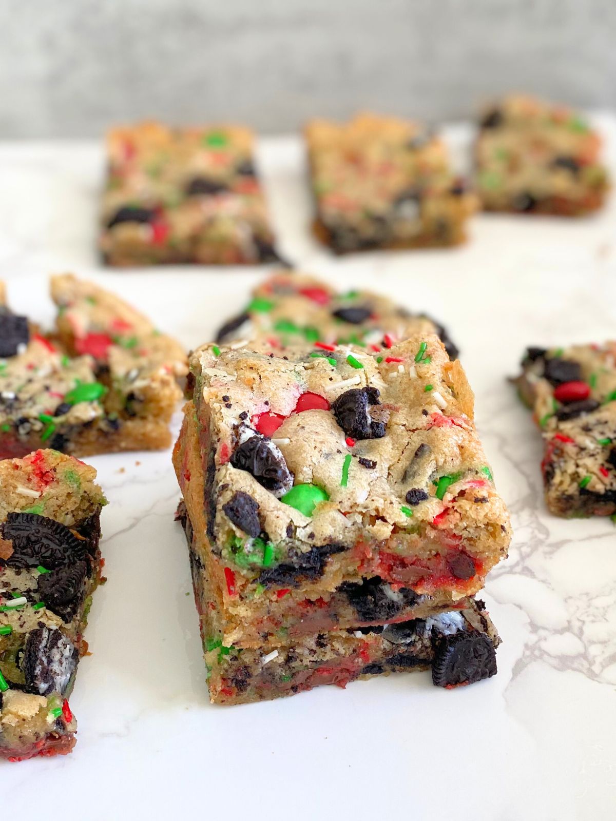 Christmas themed blondies with Oreos, sprinkles and red and green M&Ms