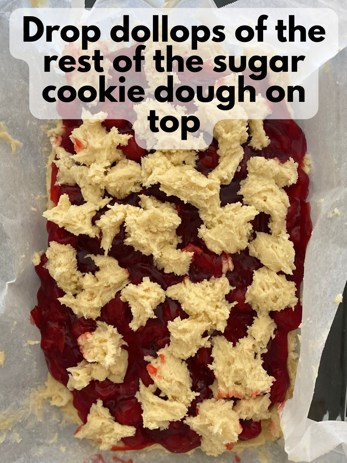 rest of the sugar cookie dough dolloped on top of the cherry pie filling