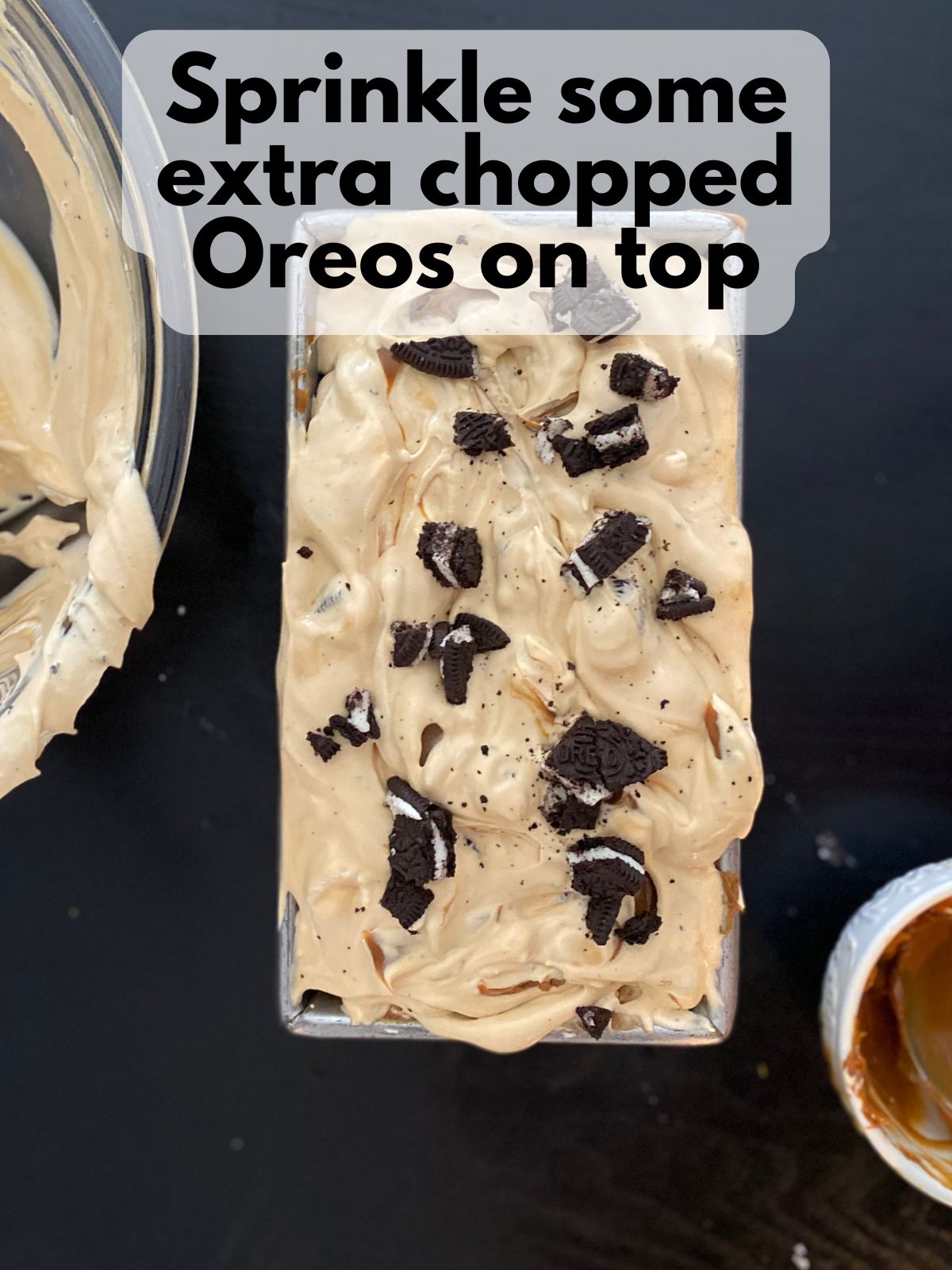 dulce de leche Oreo ice cream in a loaf pan with extra Oreos sprinkled on top