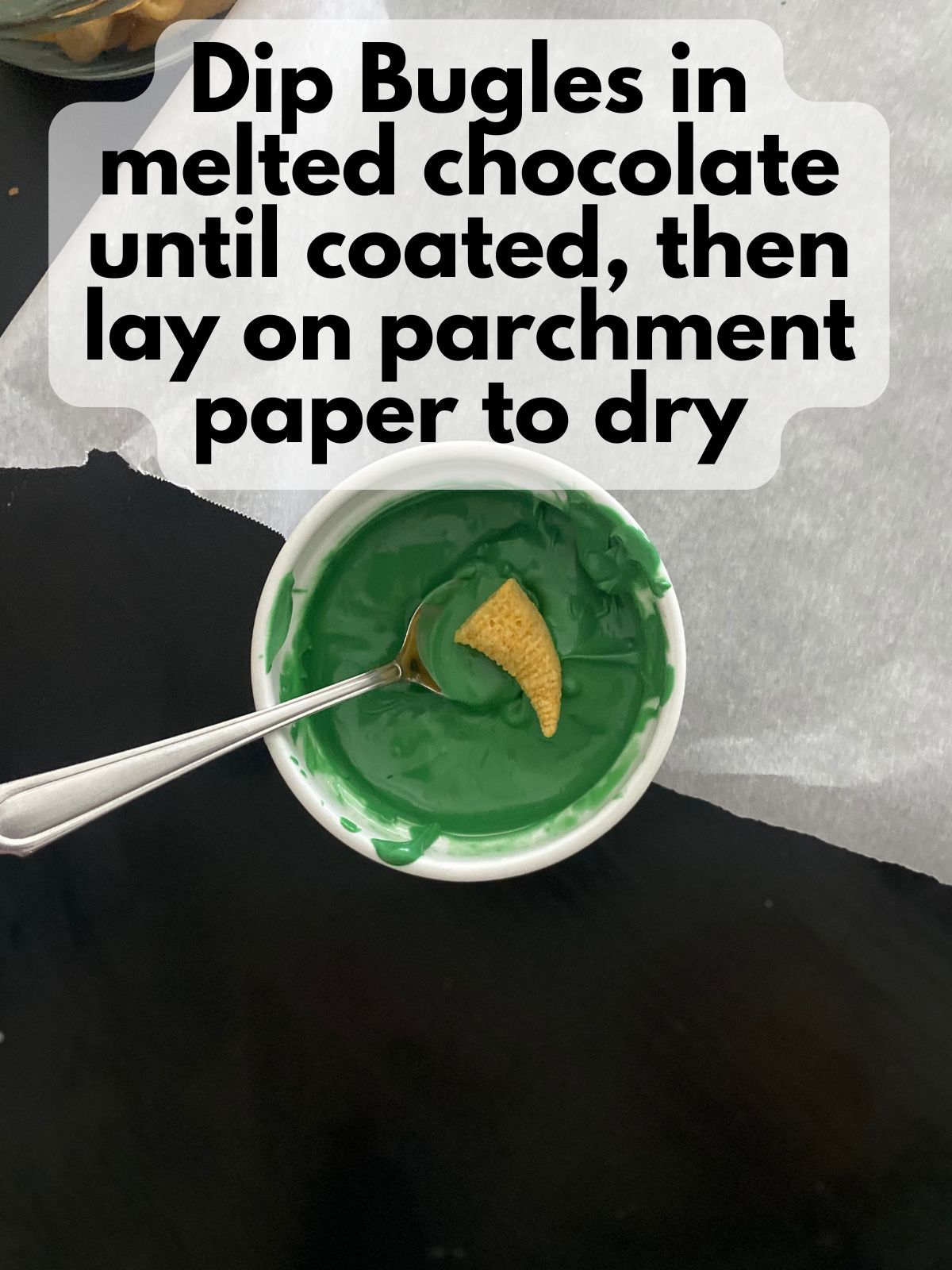 Bugle in melted green chocolate