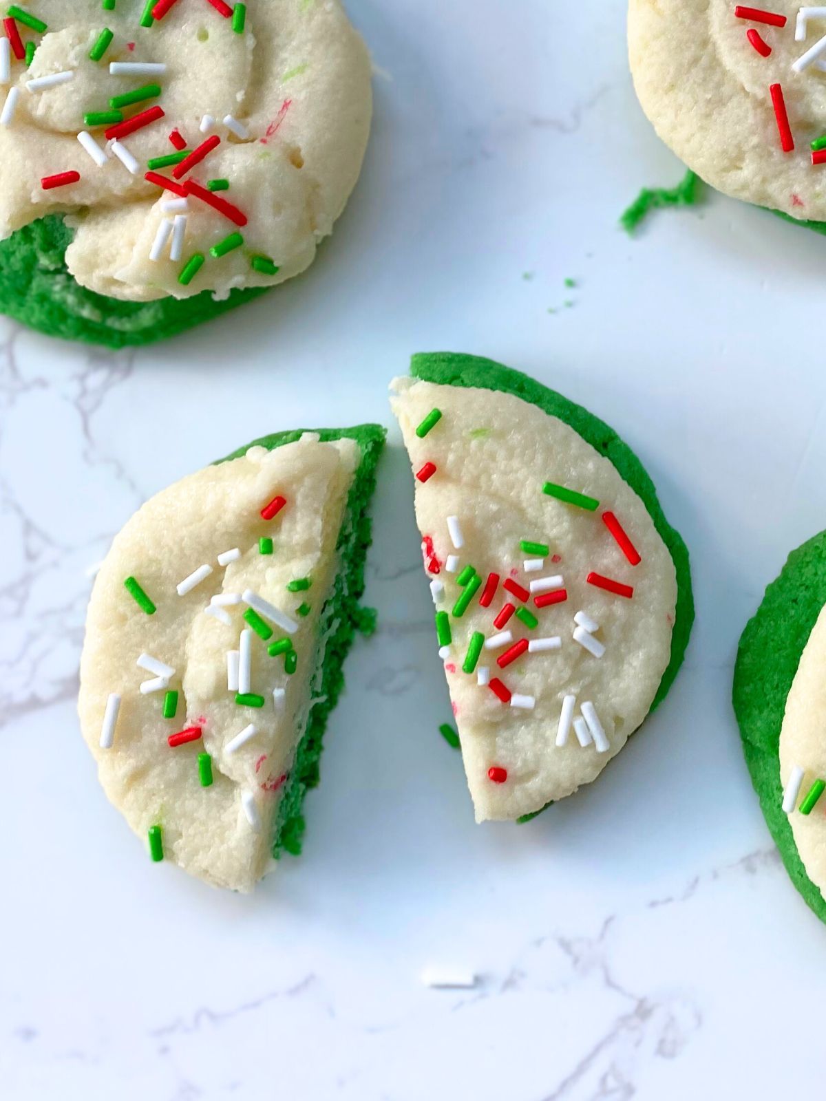 green buttercream frosted Christmas cookies