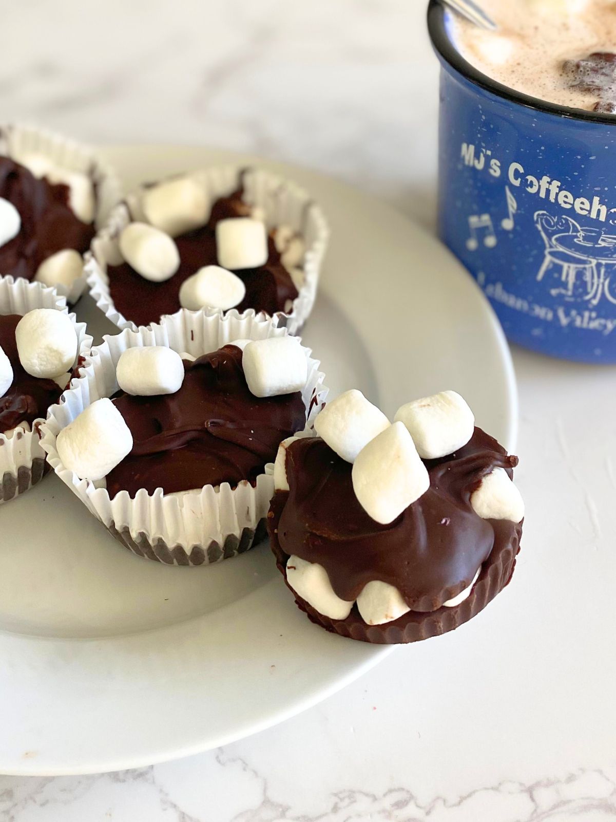 hot chocolate pucks with mini marshmallows on a plate