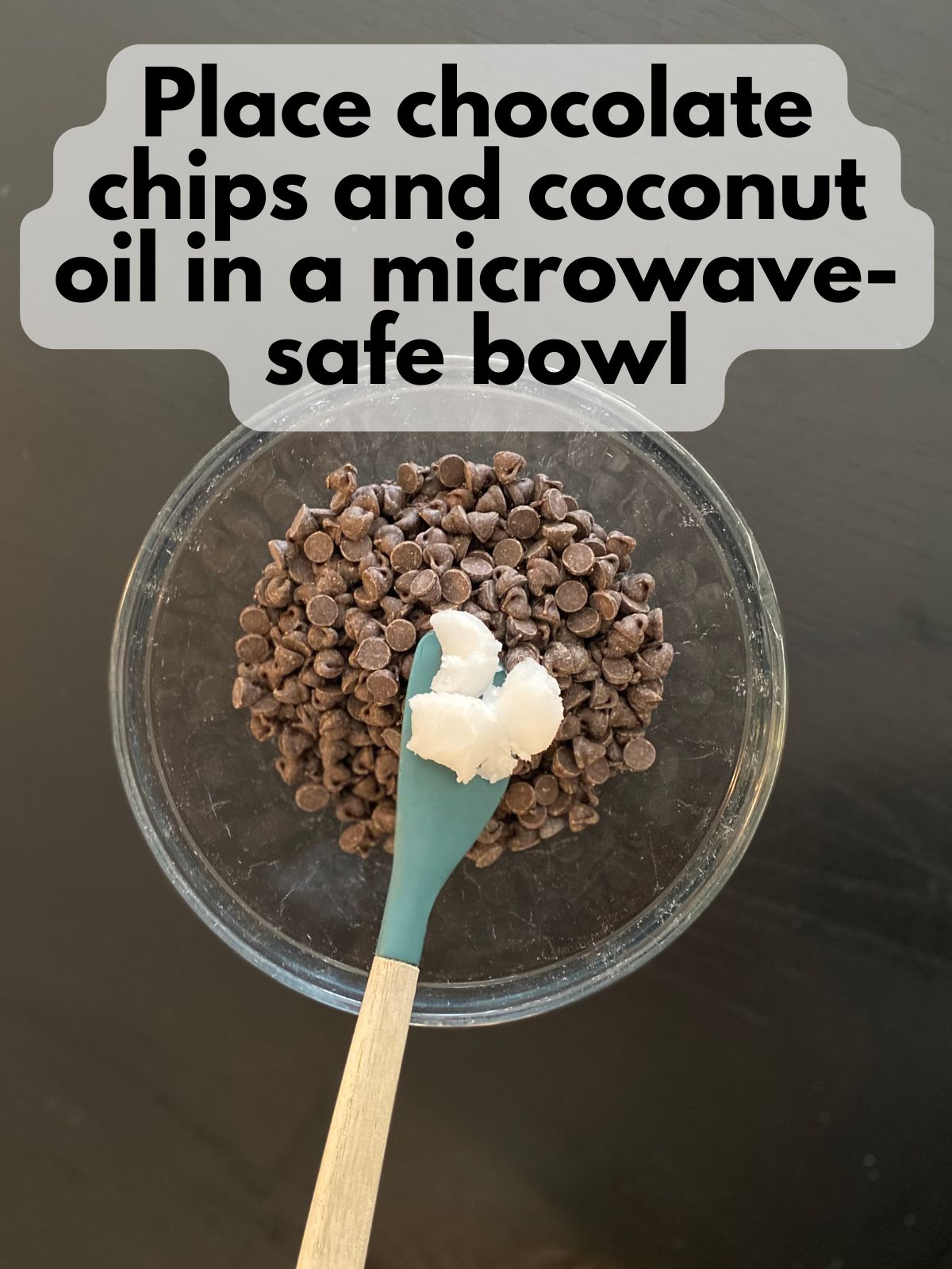 chocolate chips in a bowl with a bit of coconut oil