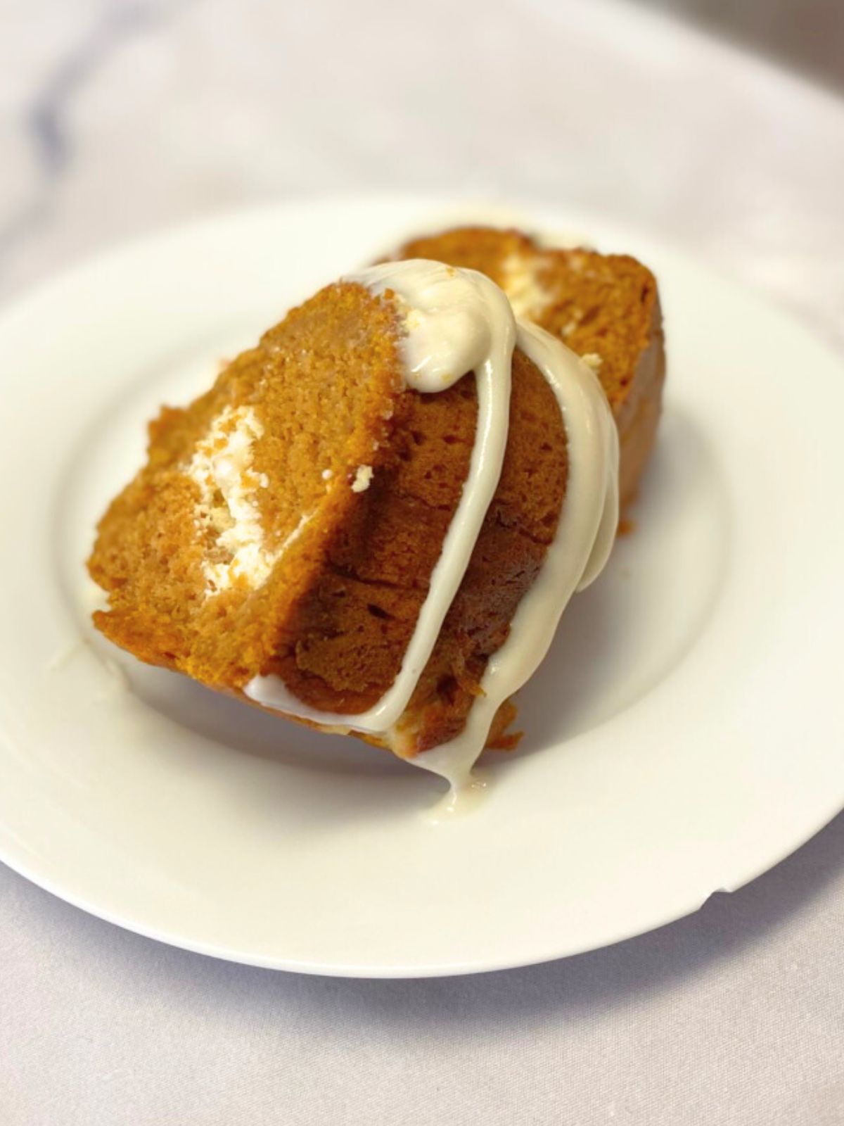 pumpkin spice budnt cake with cream cheese filling and drizzle