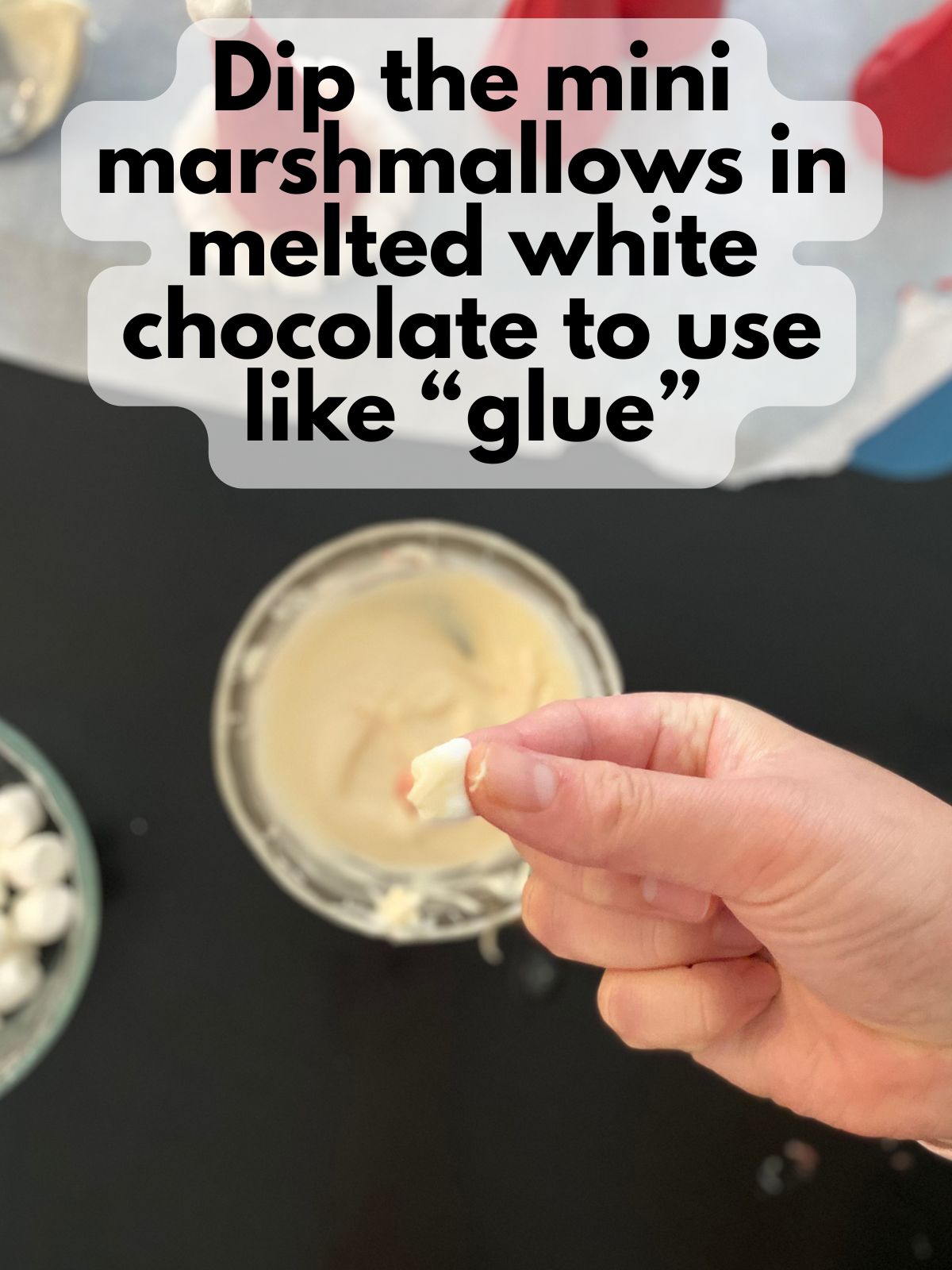 mini marshmallow dipped in melted white chocolate