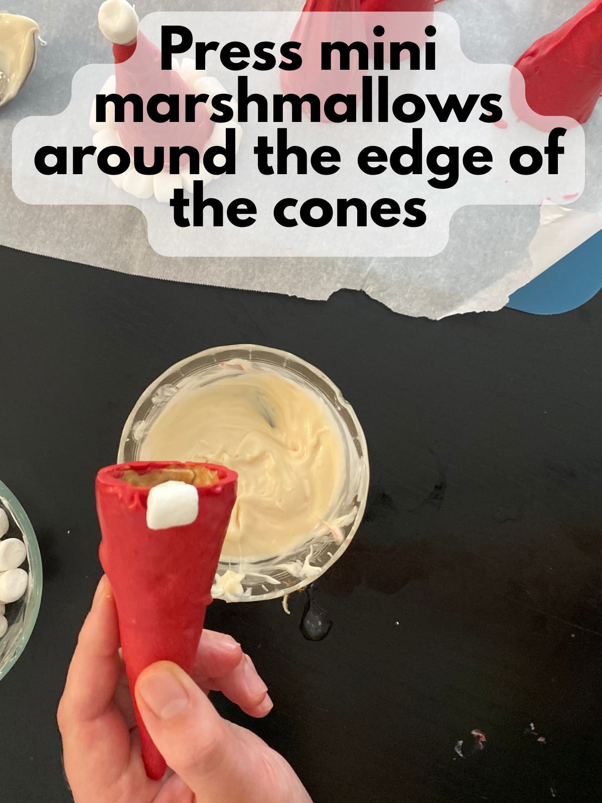 mini marshmallow pressed onto the side of a decorated ice cream cone