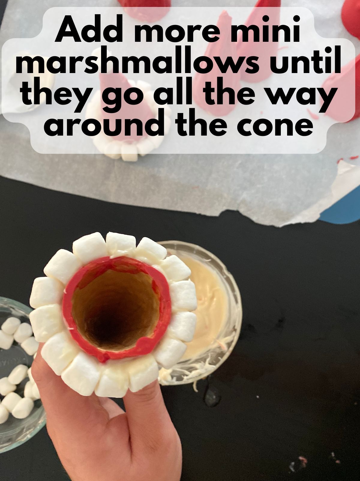 mini marshmallows all the way around the rim of a decorated ice cream cone