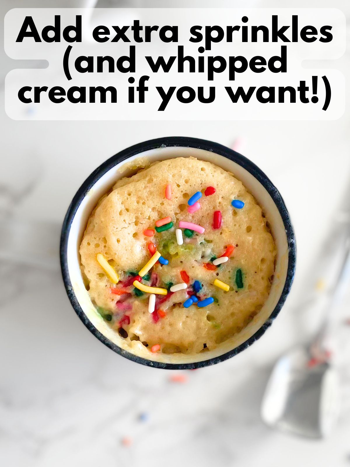 birthday cake protein mug cake with extra sprinkles on top