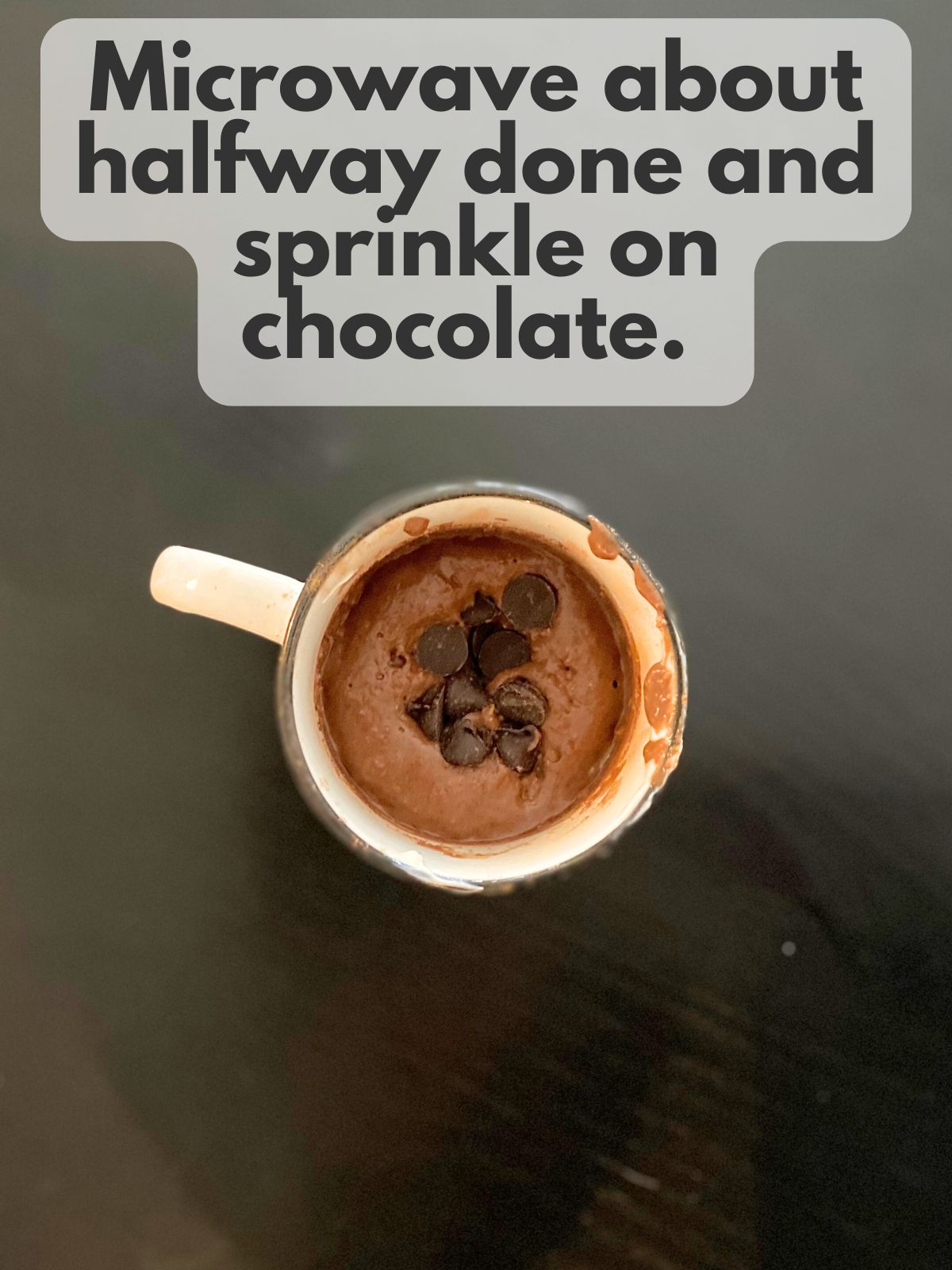 dark chocolate in the middle of mug cake batter