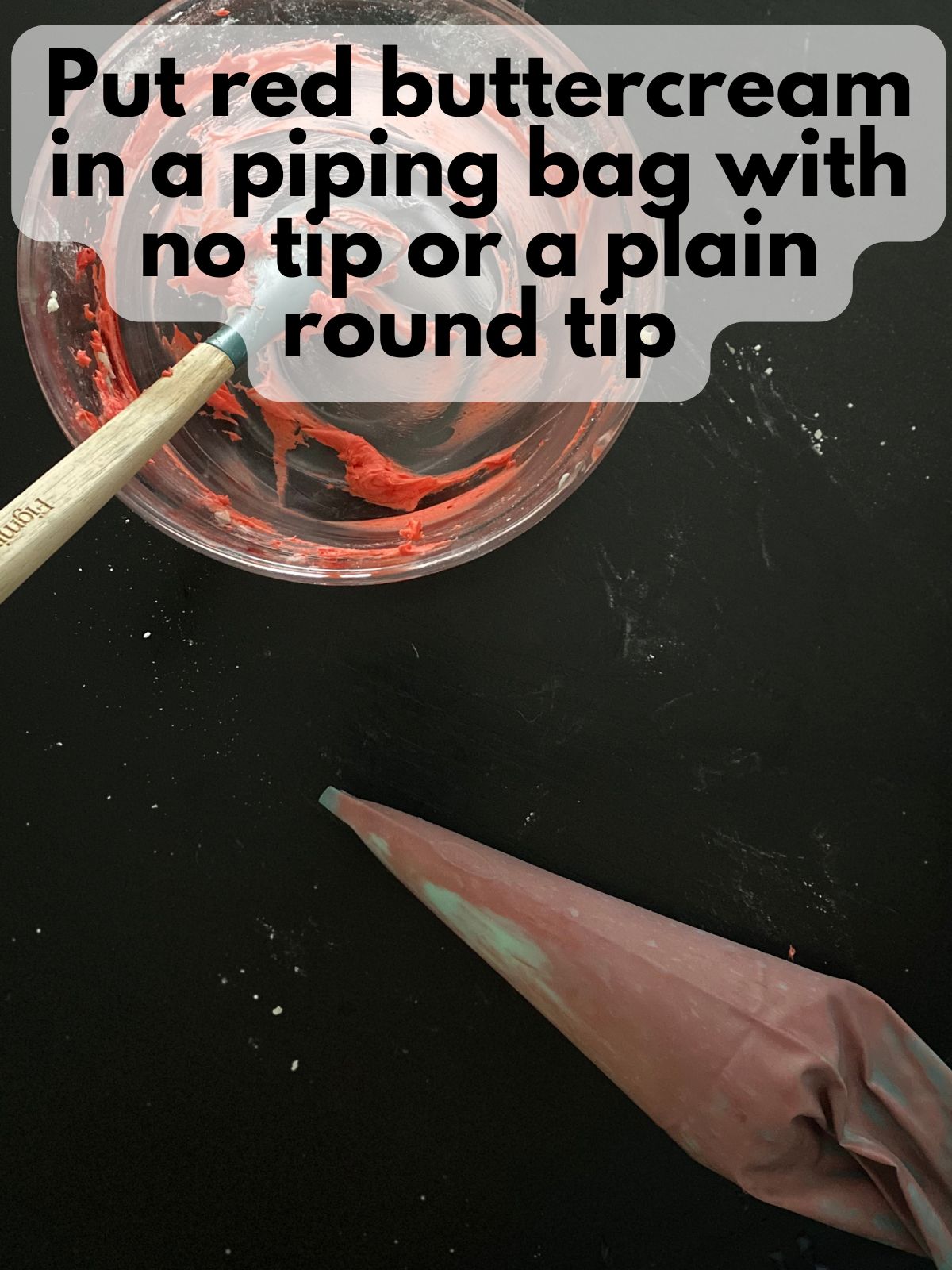 red buttercream frosting in a piping bag