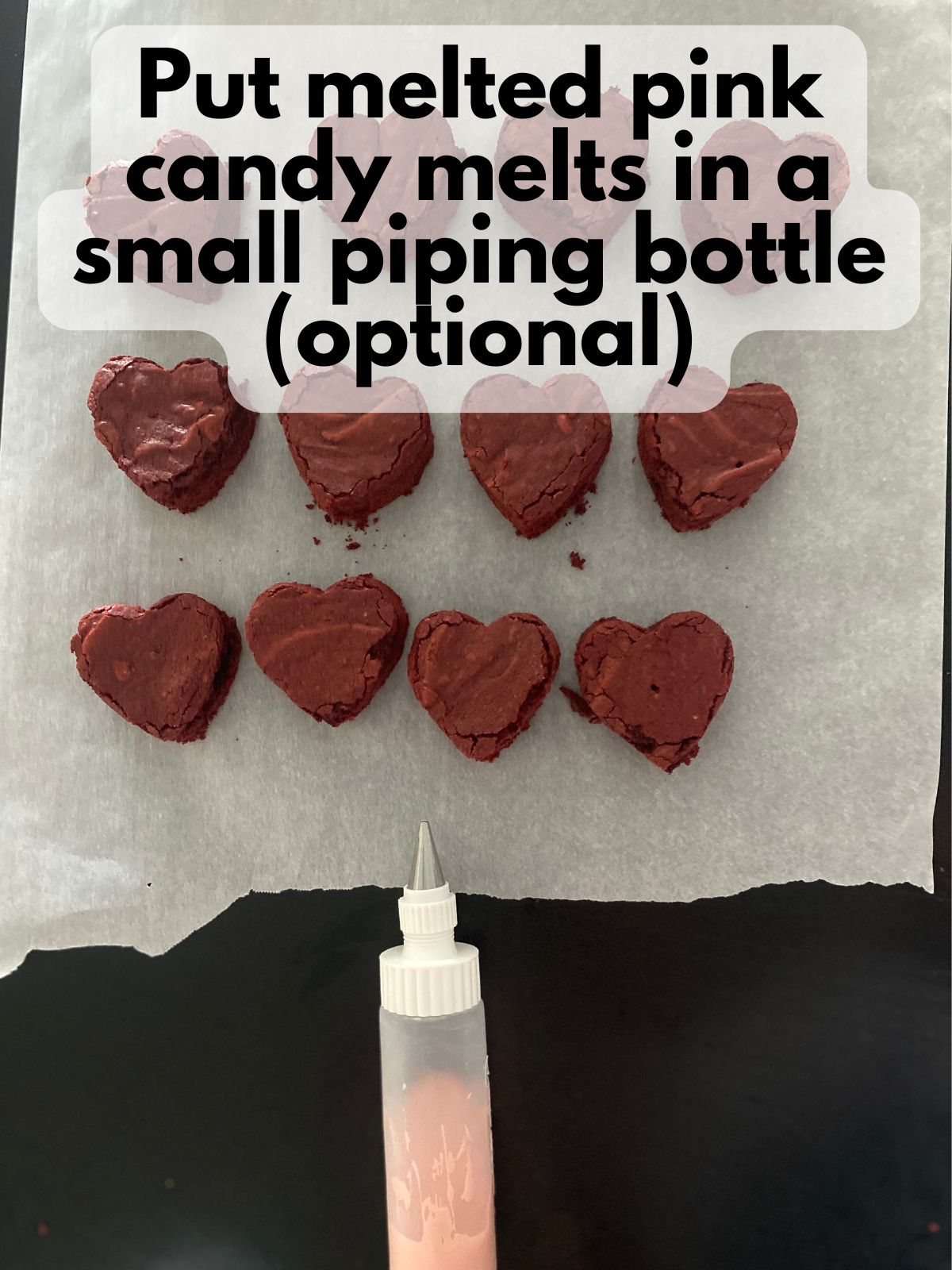 melted pink chocolate in a small piping bottle