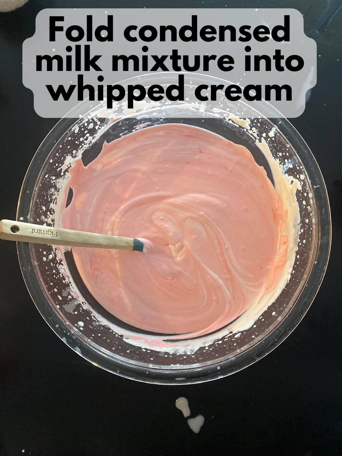 sweetened condensed milk with cherry extract folded into whipped cream