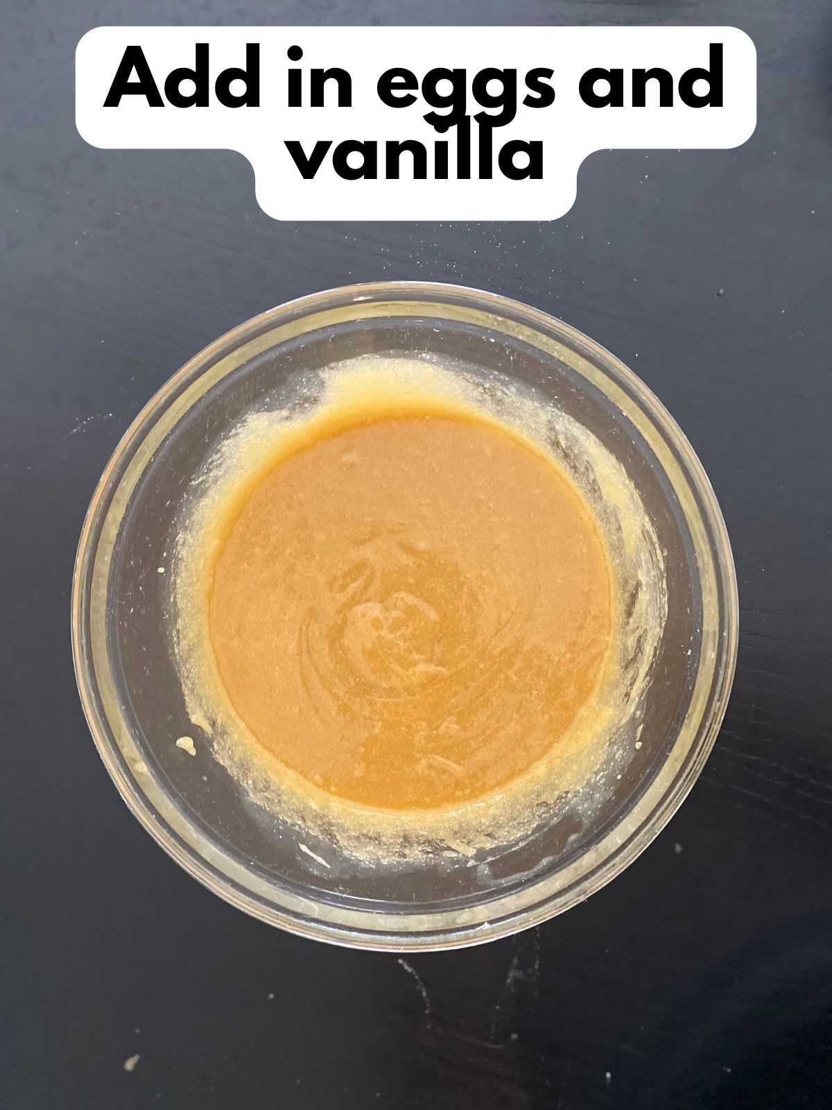 eggs and vanilla added to melted butter and sugars