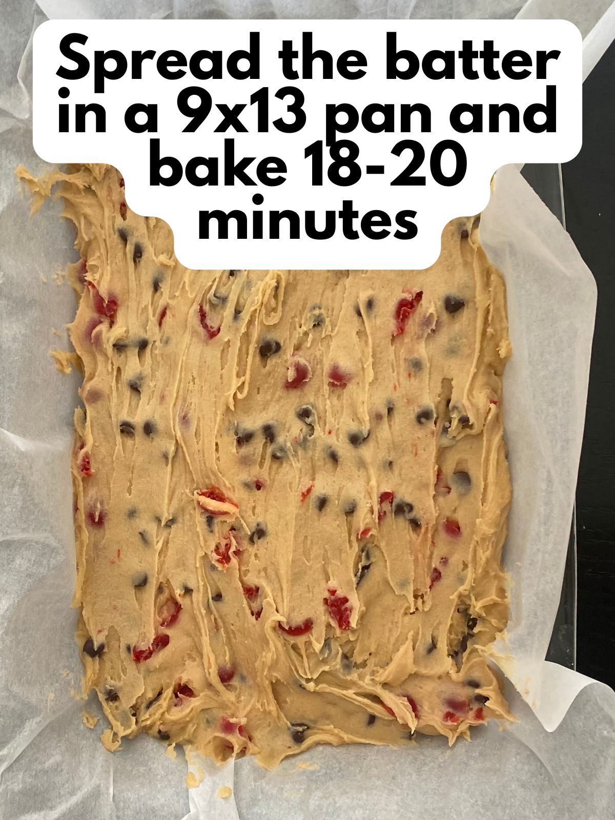 cookie bar batter spread in a 9x13 pan