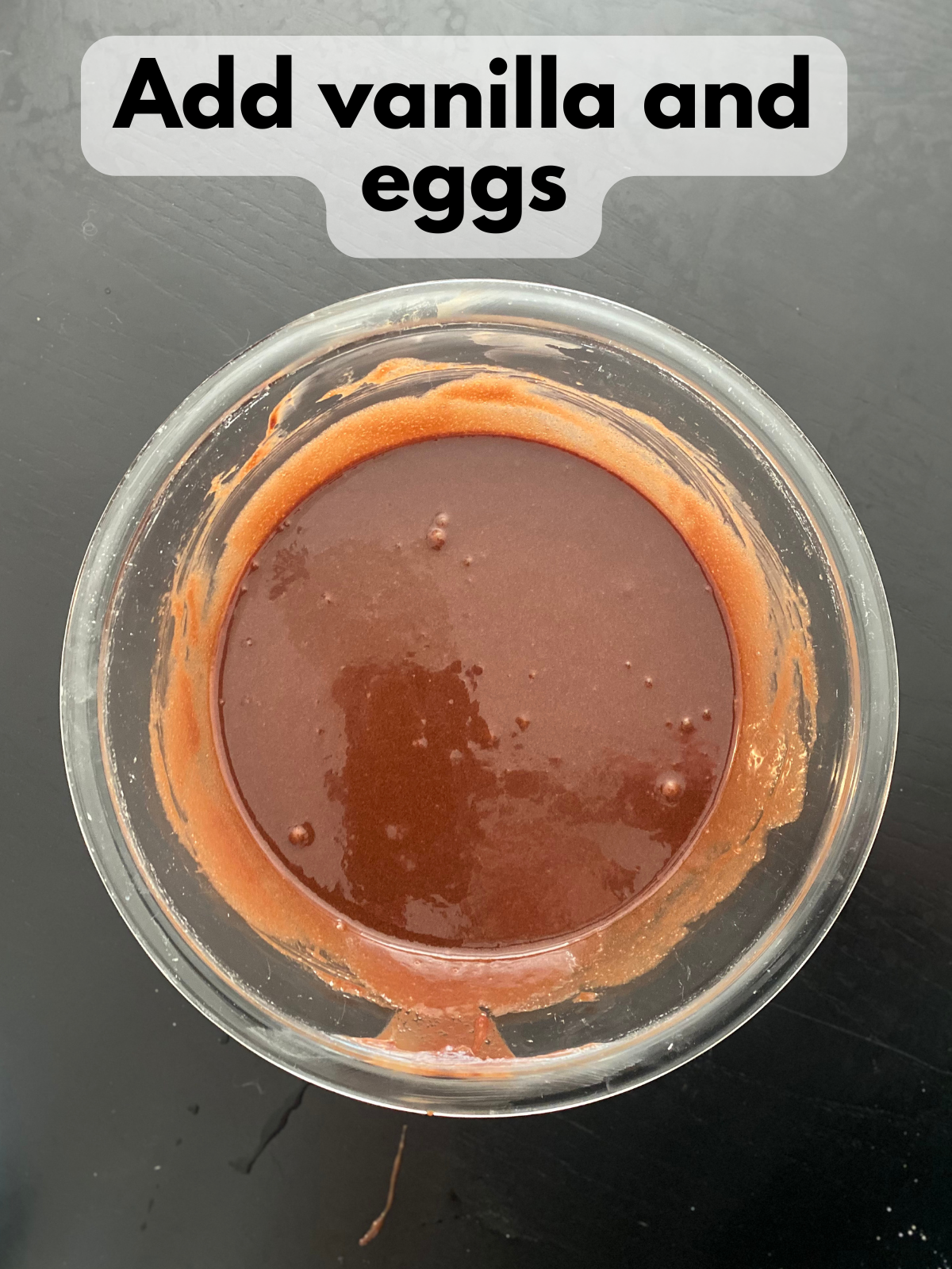vanilla and eggs whisked into melted butter and chocolate