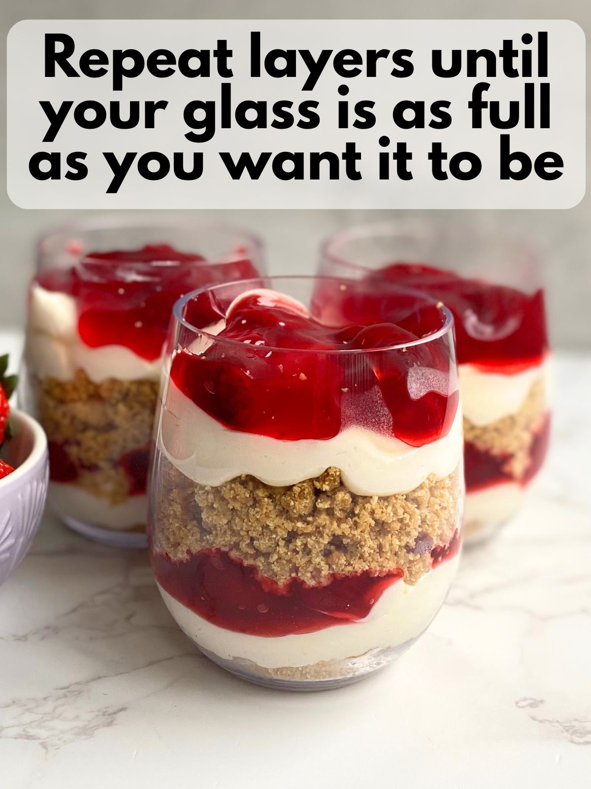 strawberry pie cheesecake cups with all its layers