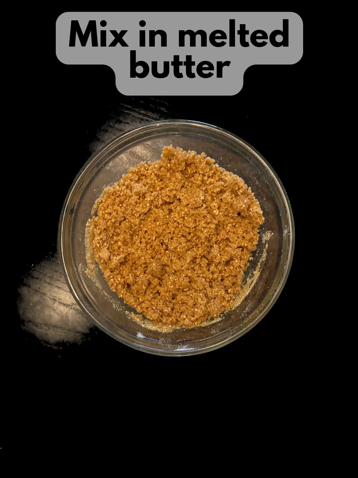 graham cracker crumbs and brown sugar with melted butter mixed in