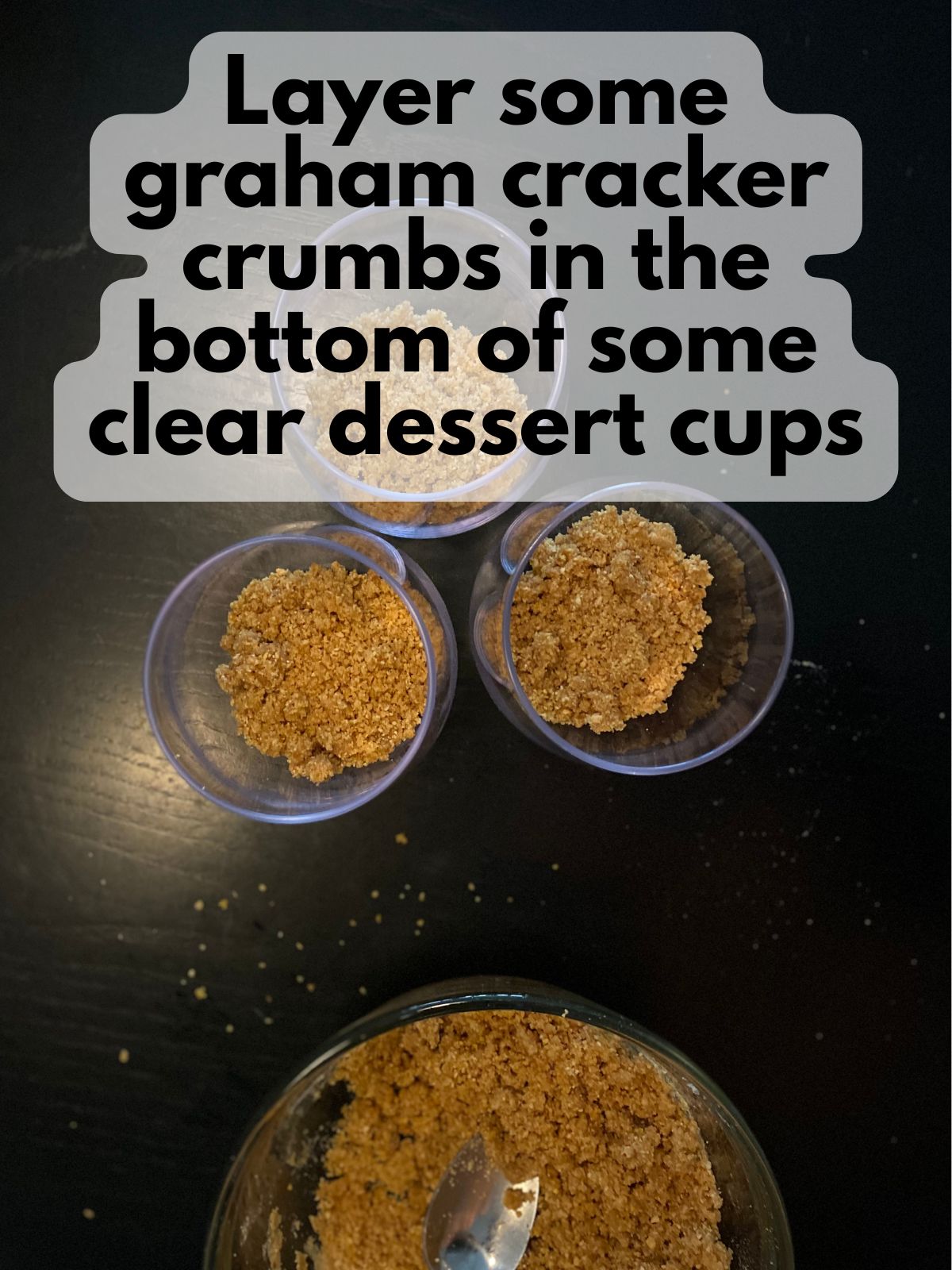 graham cracker crumbs in the bottom of glasses