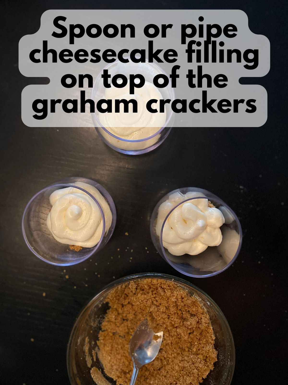 cheesecake filling piped on top of graham cracker crumbs